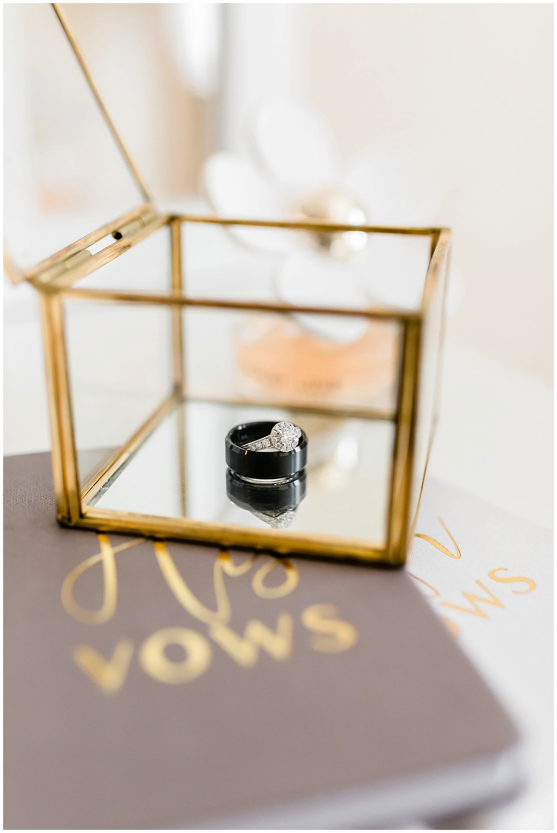  wedding bands in glass box 