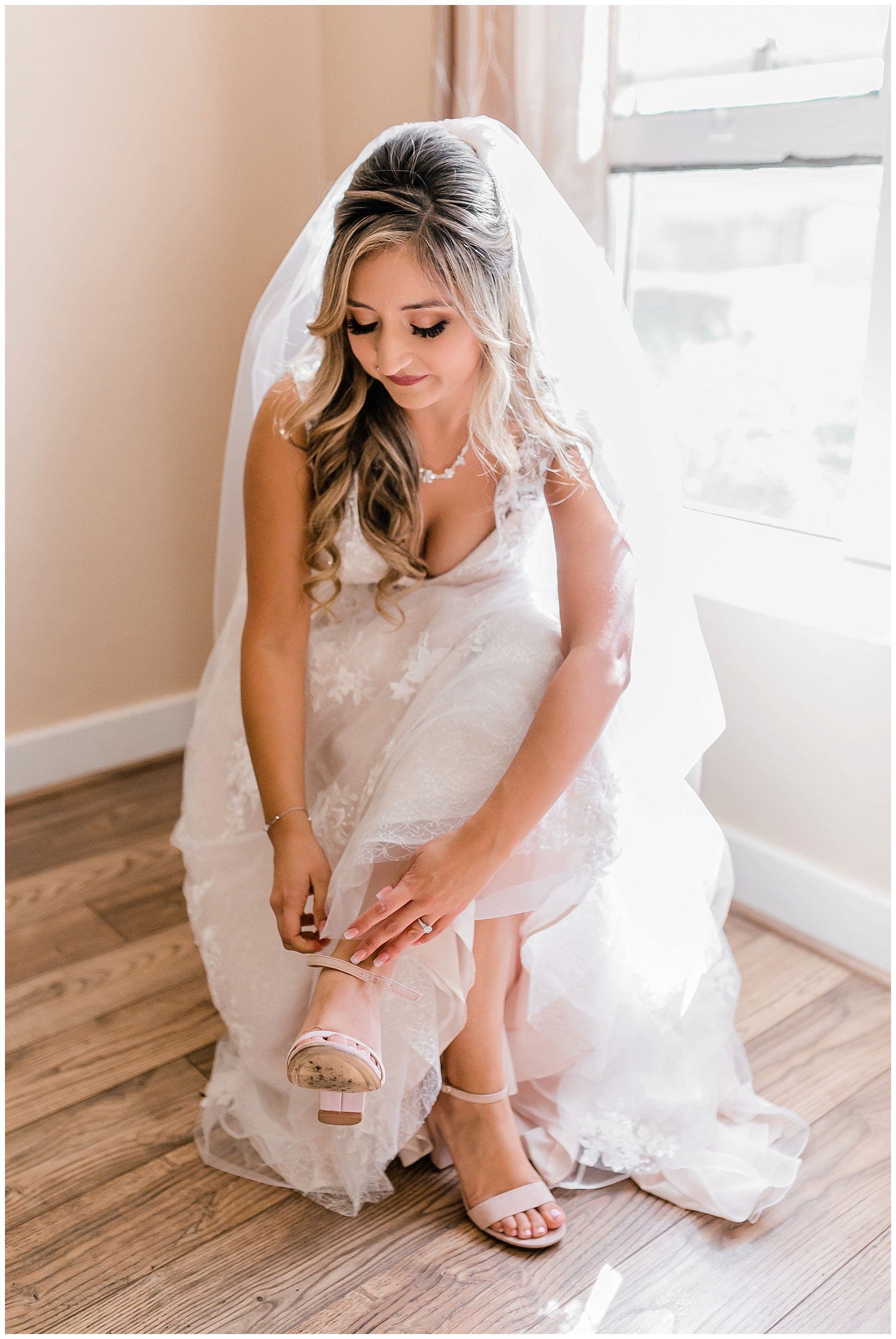  bride putting on her shoes 