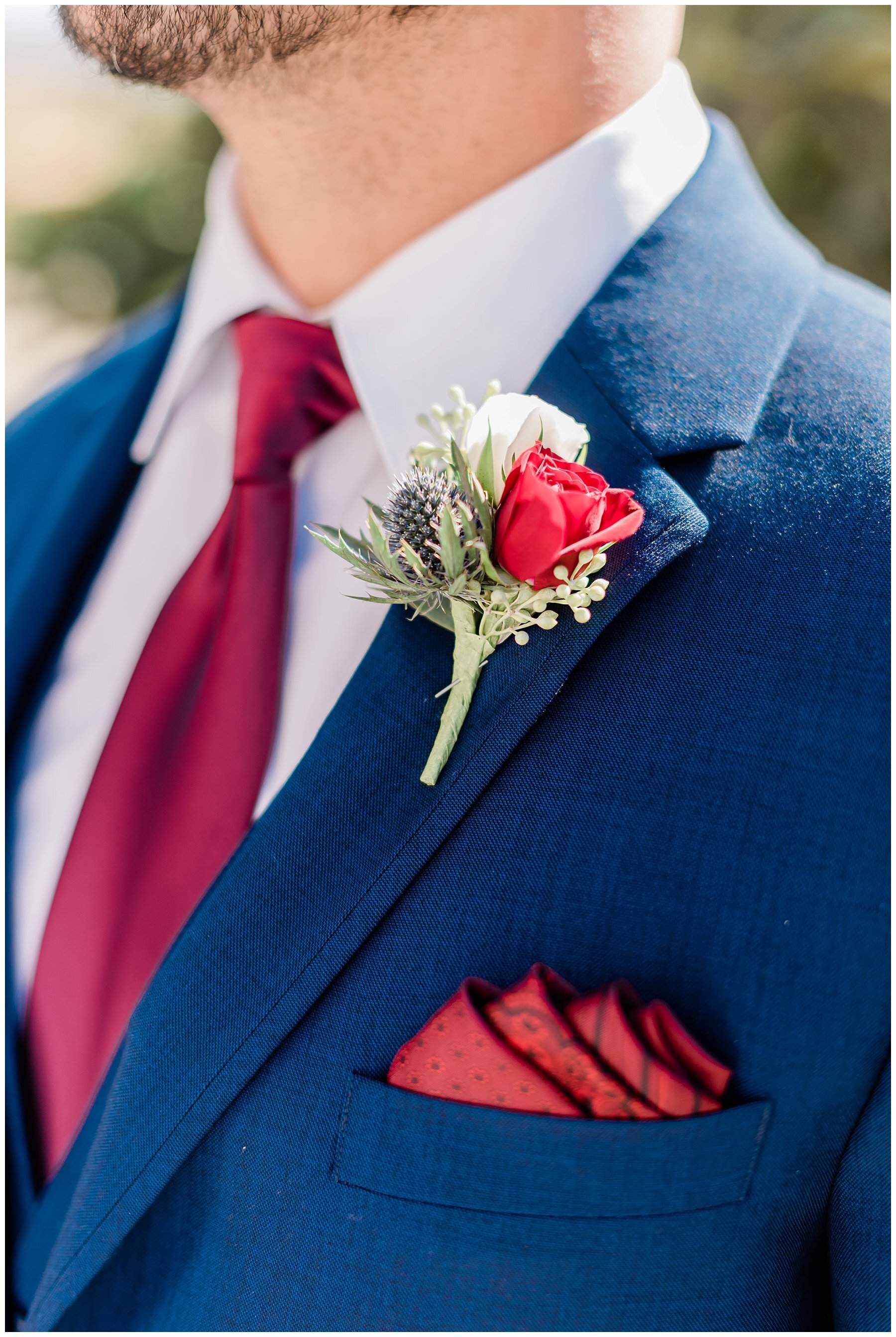  groom wearing pocket square and boutonnière  