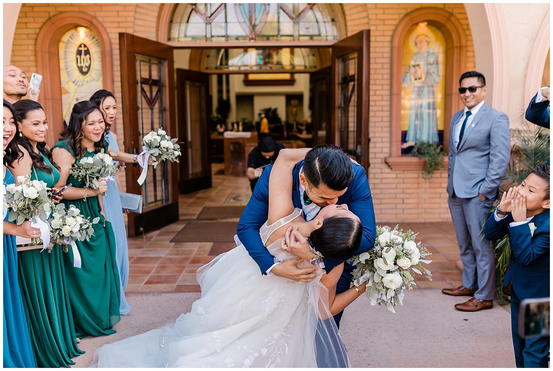  groom dips and kisses the bride 