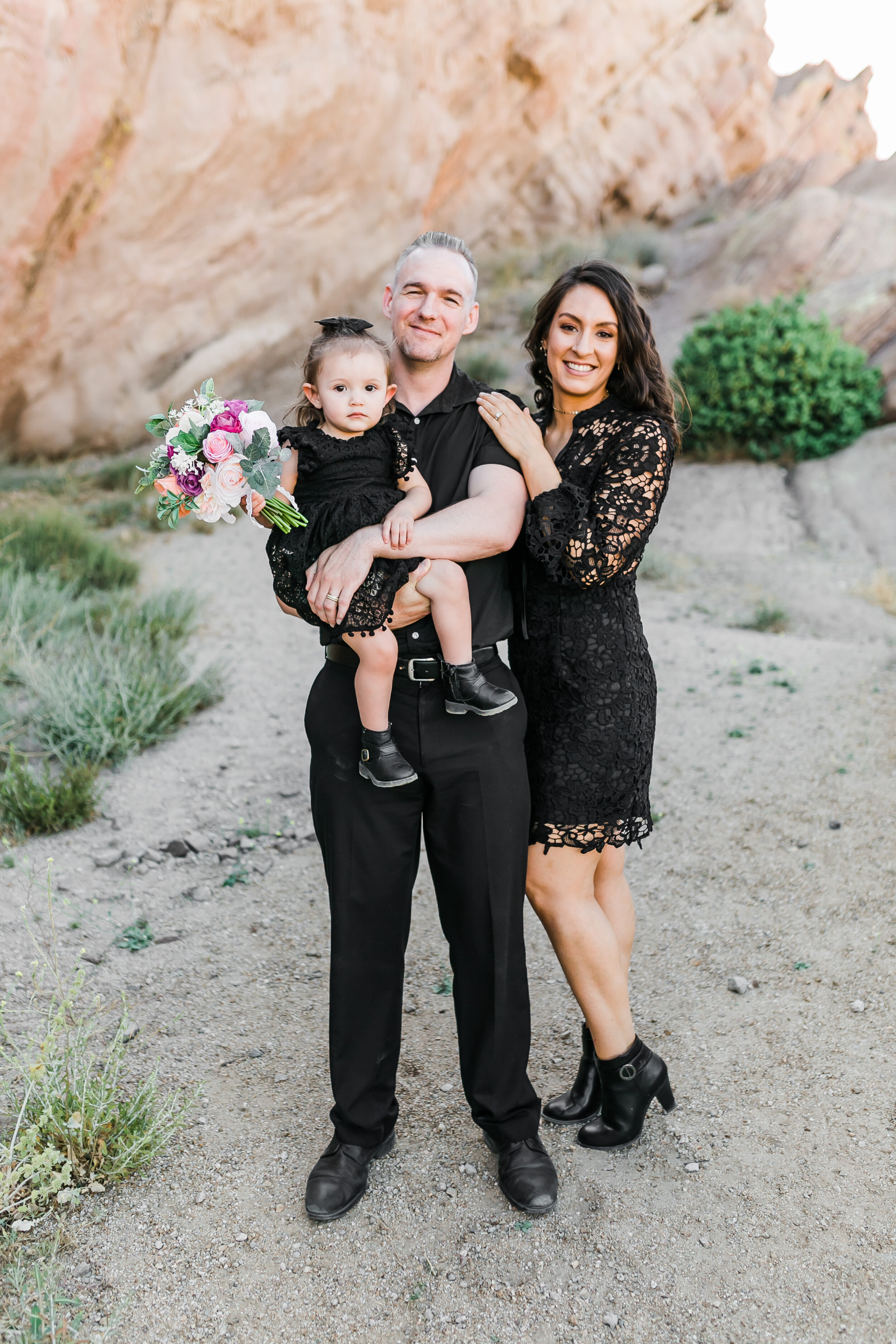  engagement photo with their daughter at vasquez rocks 