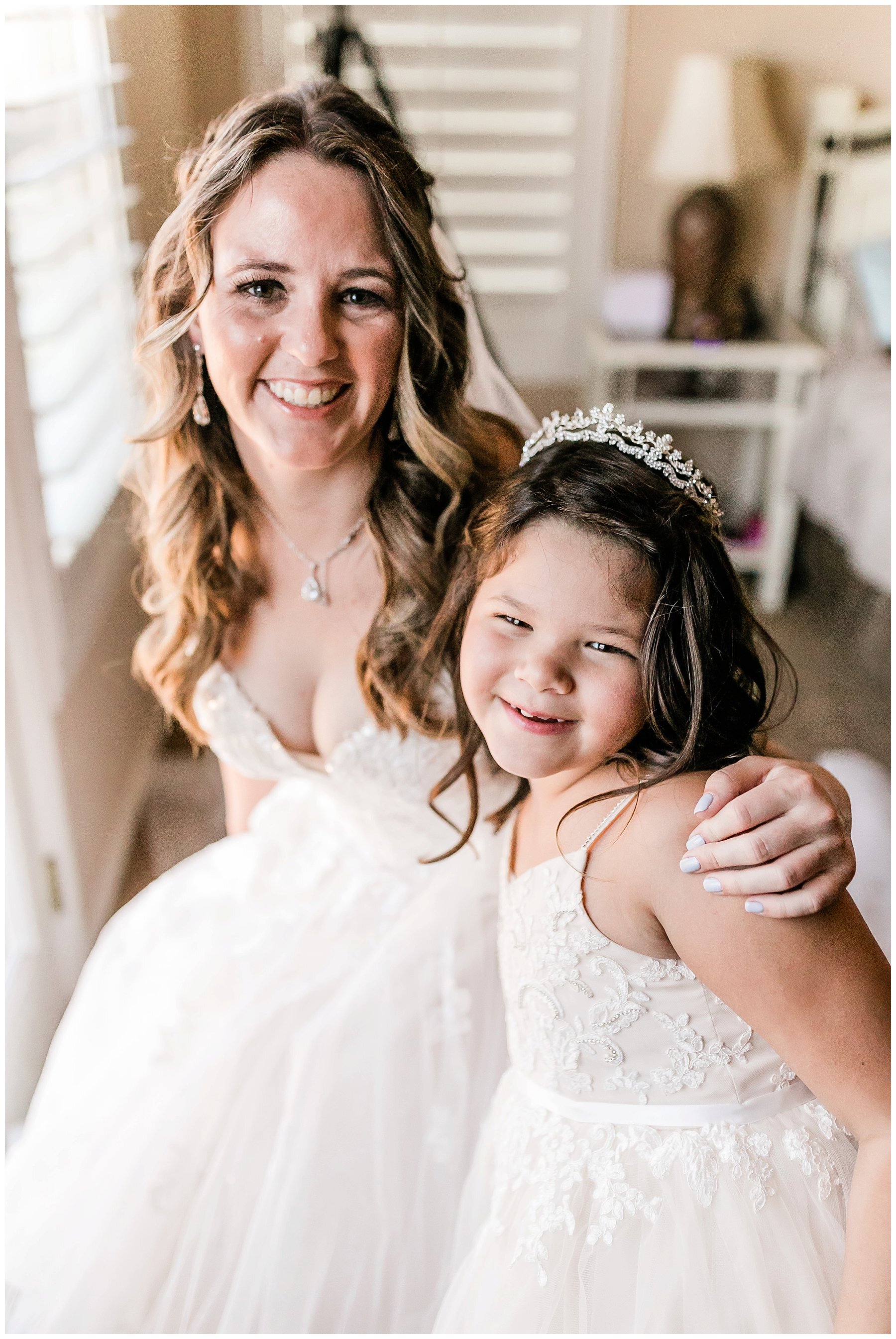  bride with the flower girl in the bridal suite 