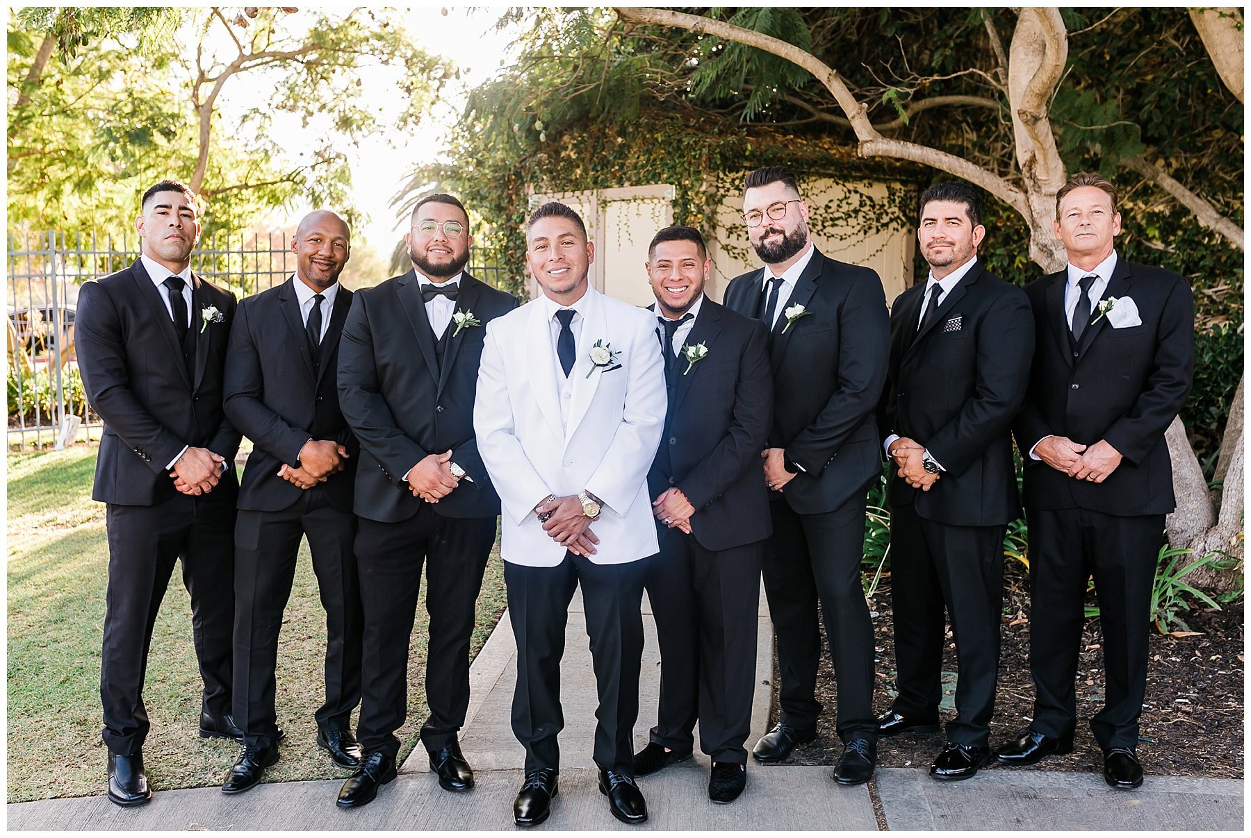  groomsmen standing together outside sterling hills 