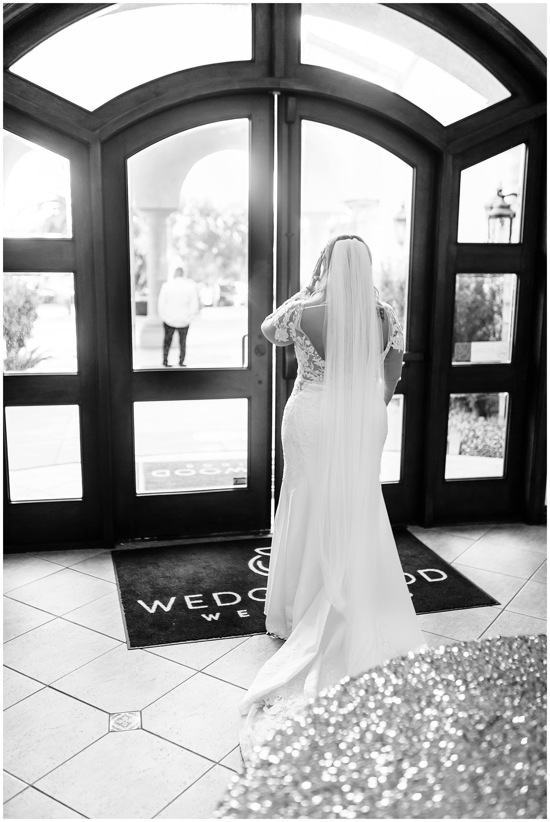  bride looking out the window  