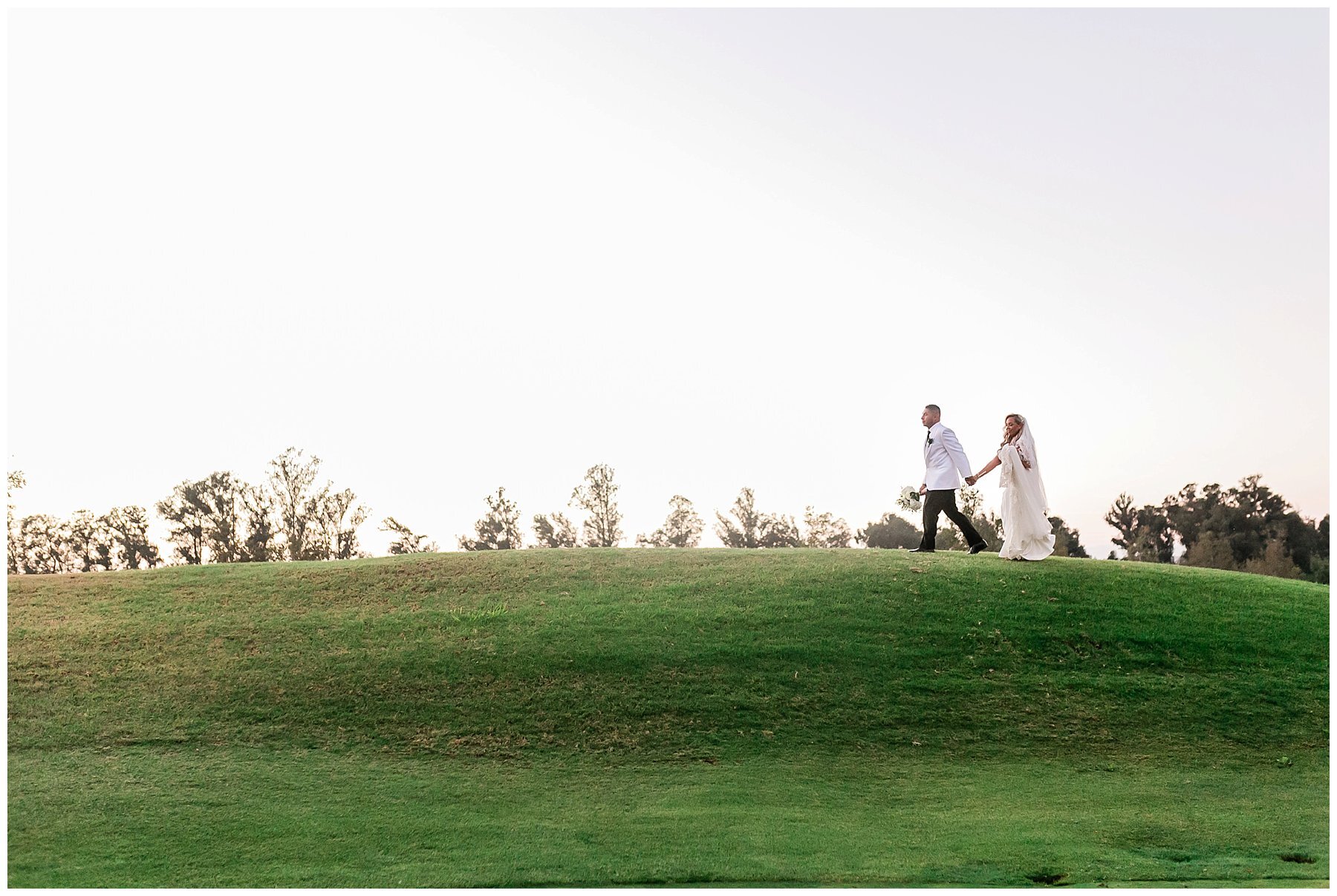  bride and groom walking in the sunset 