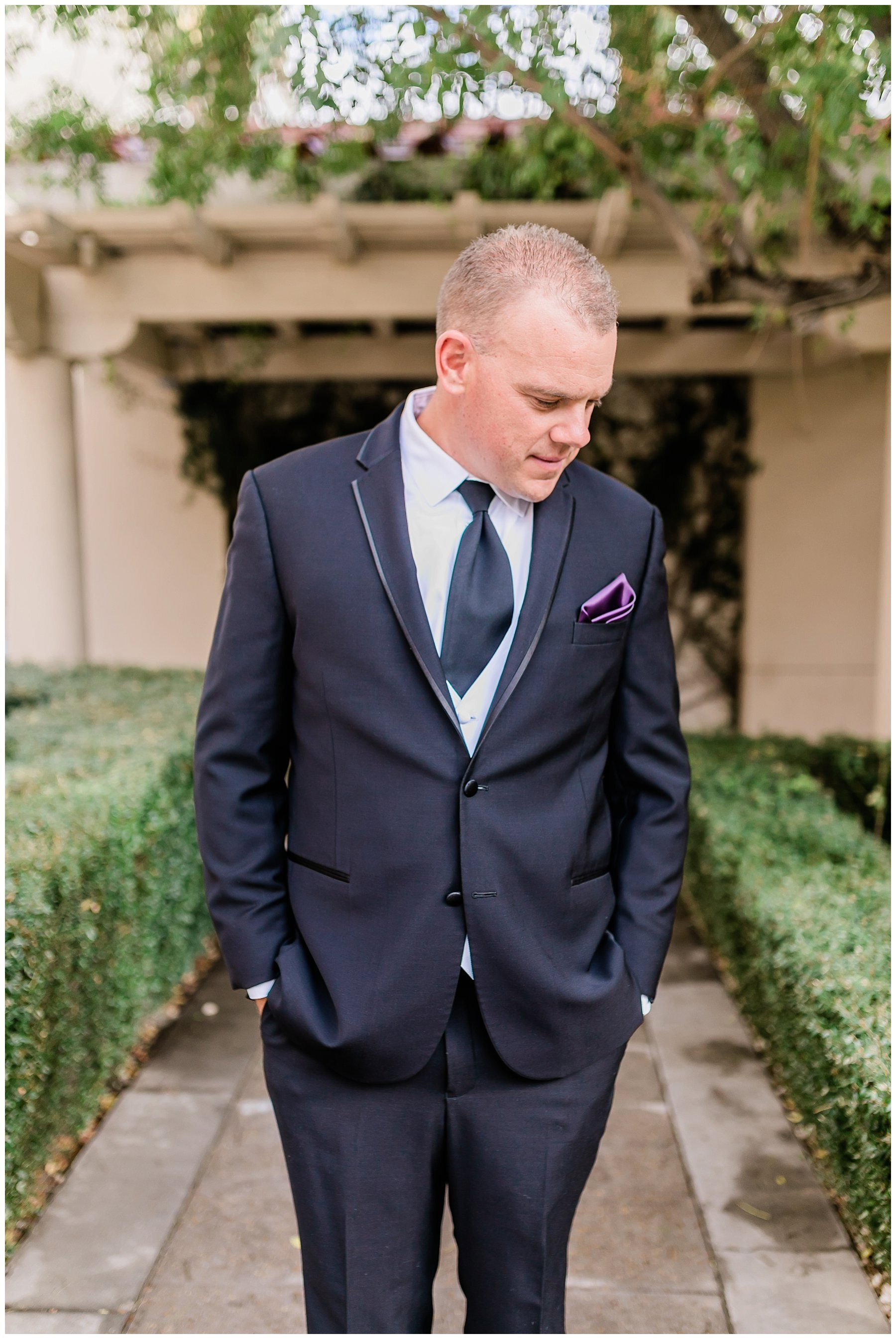  groom standing in the courtyard 