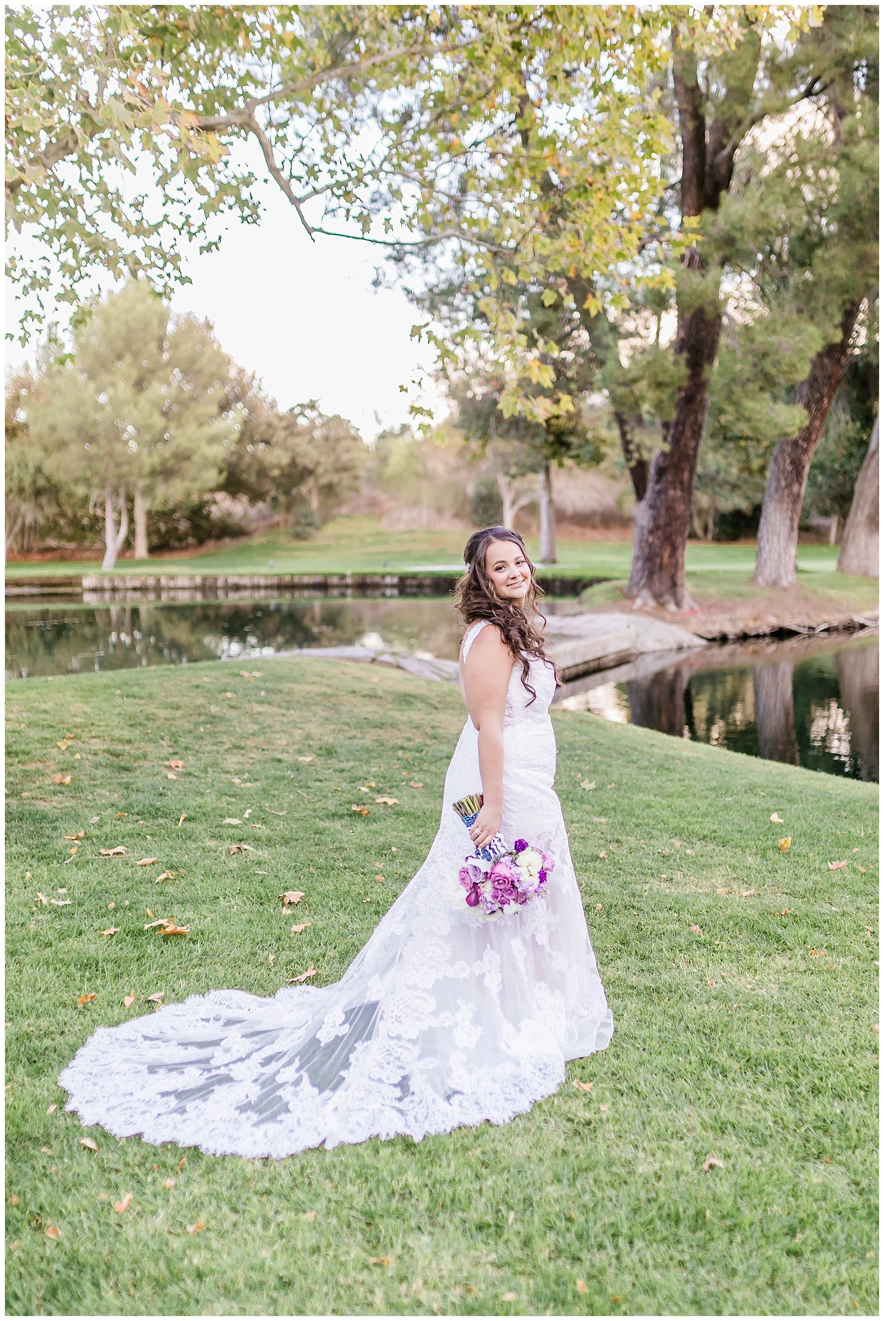  bride standing by the lake 