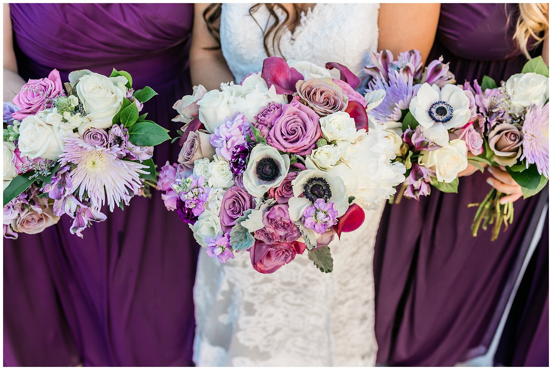  bride with her bridal party holding bouquets 
