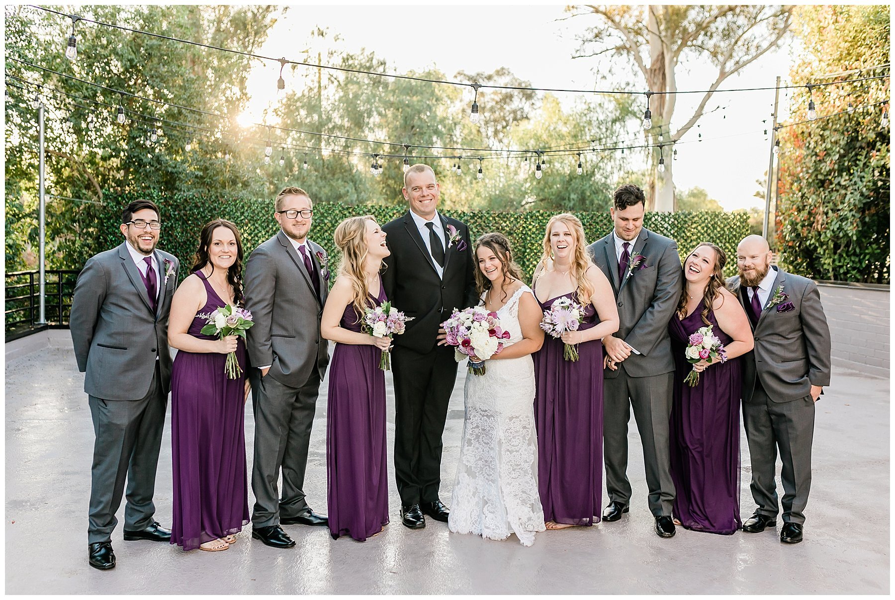  bride and groom surrounded by the wedding party 