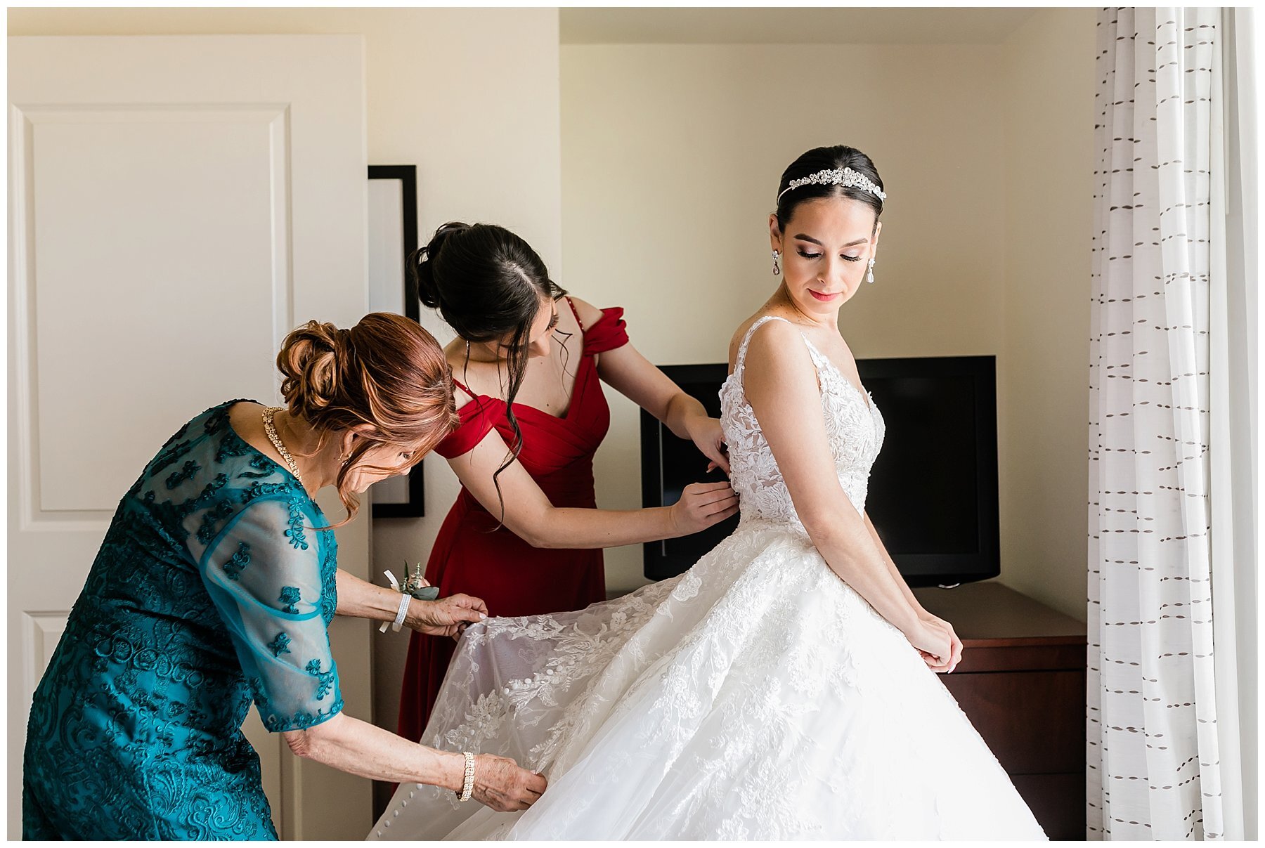  mother of the bride helping her daughter get ready 