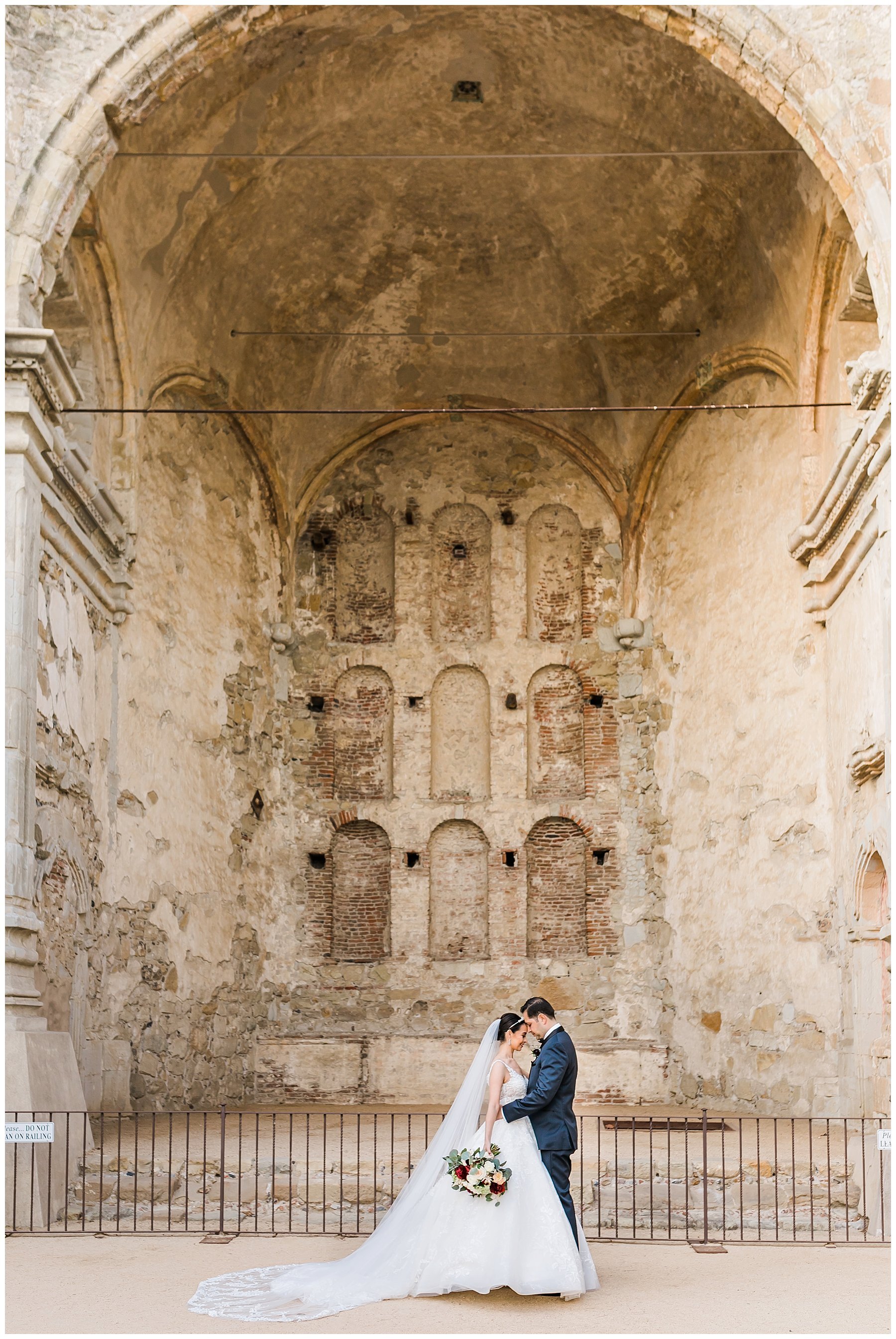  bride and groom in front of the architectural venue 