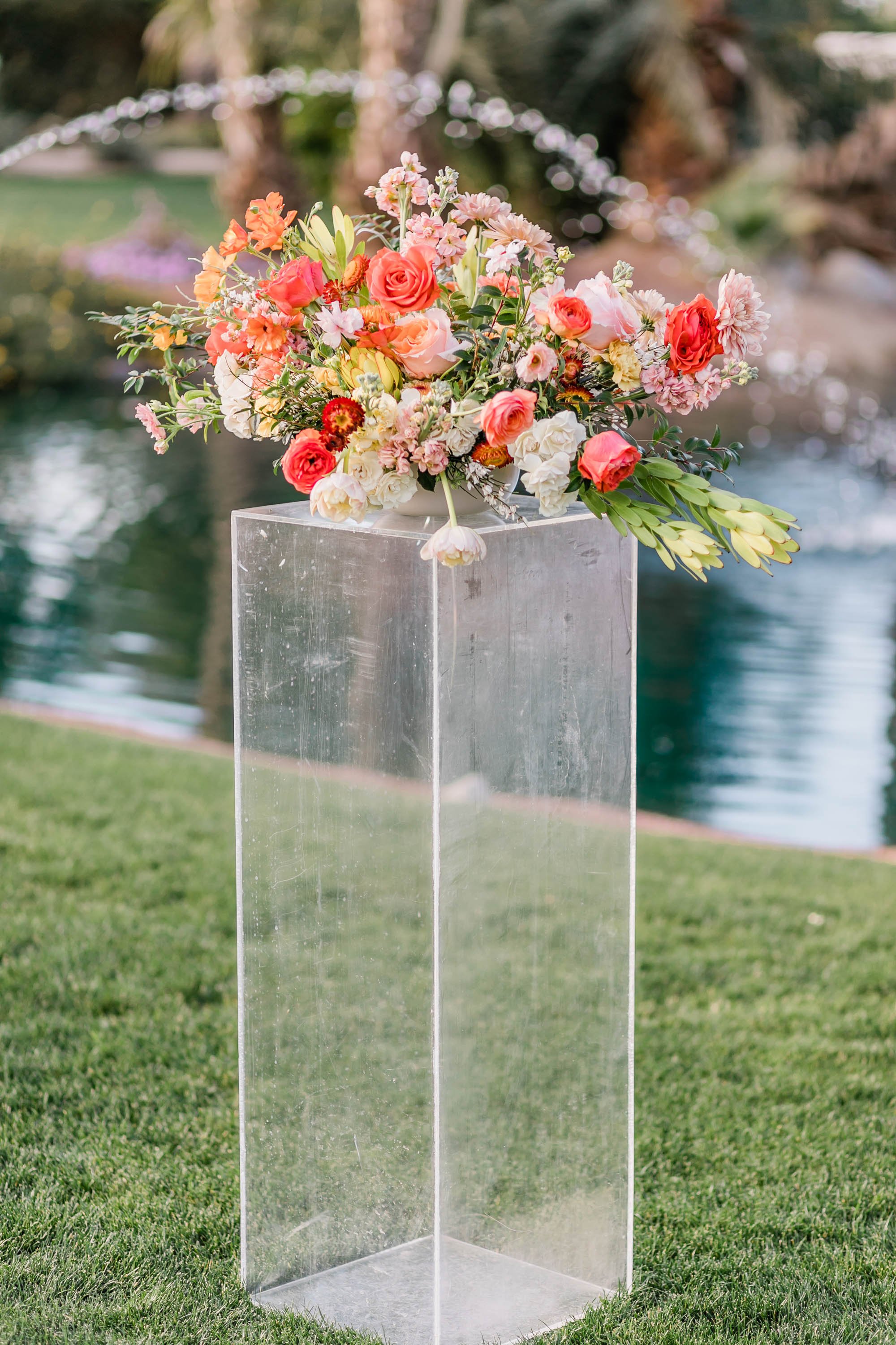 Floral arrangement for Lakeside Palm Springs wedding ceremony at Bougainvillea Estate. 