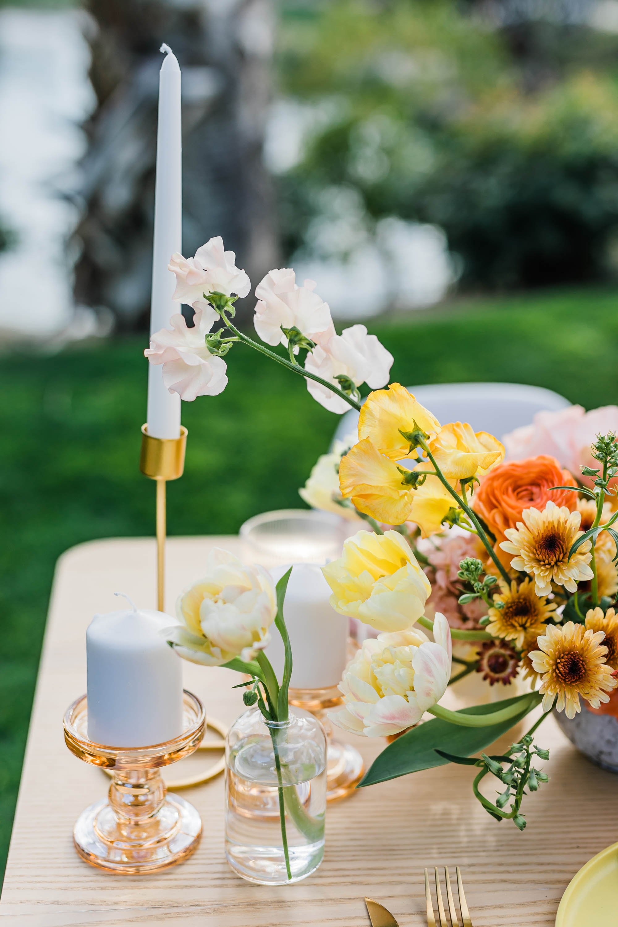 Bright sunny reception table scape flowers and wedding decor at Palm Springs wedding elopement at Bougainvillea Estate.