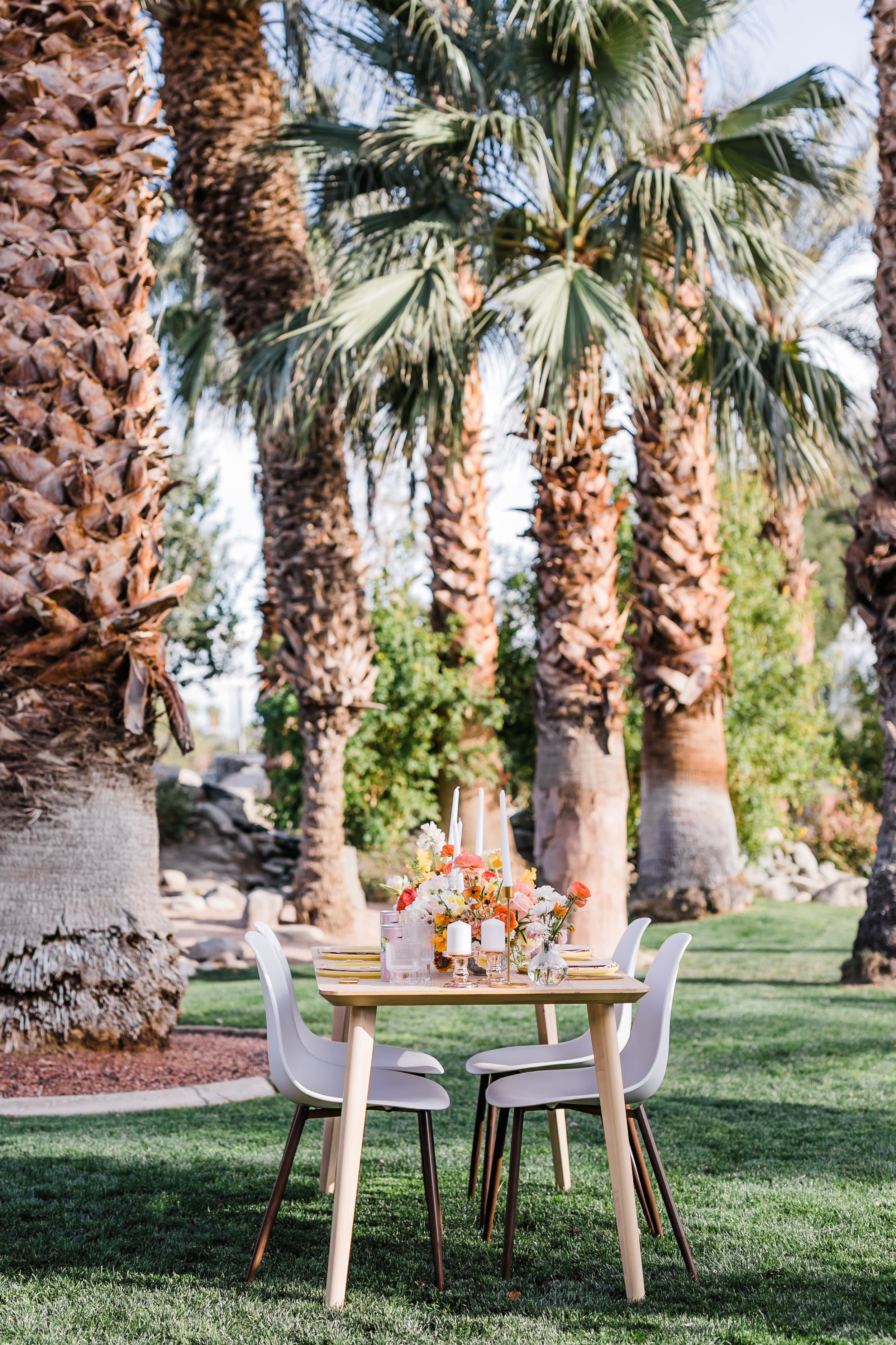 Bright sunny reception flowers and wedding decor at Palm Springs wedding elopement at Bougainvillea Estate.
