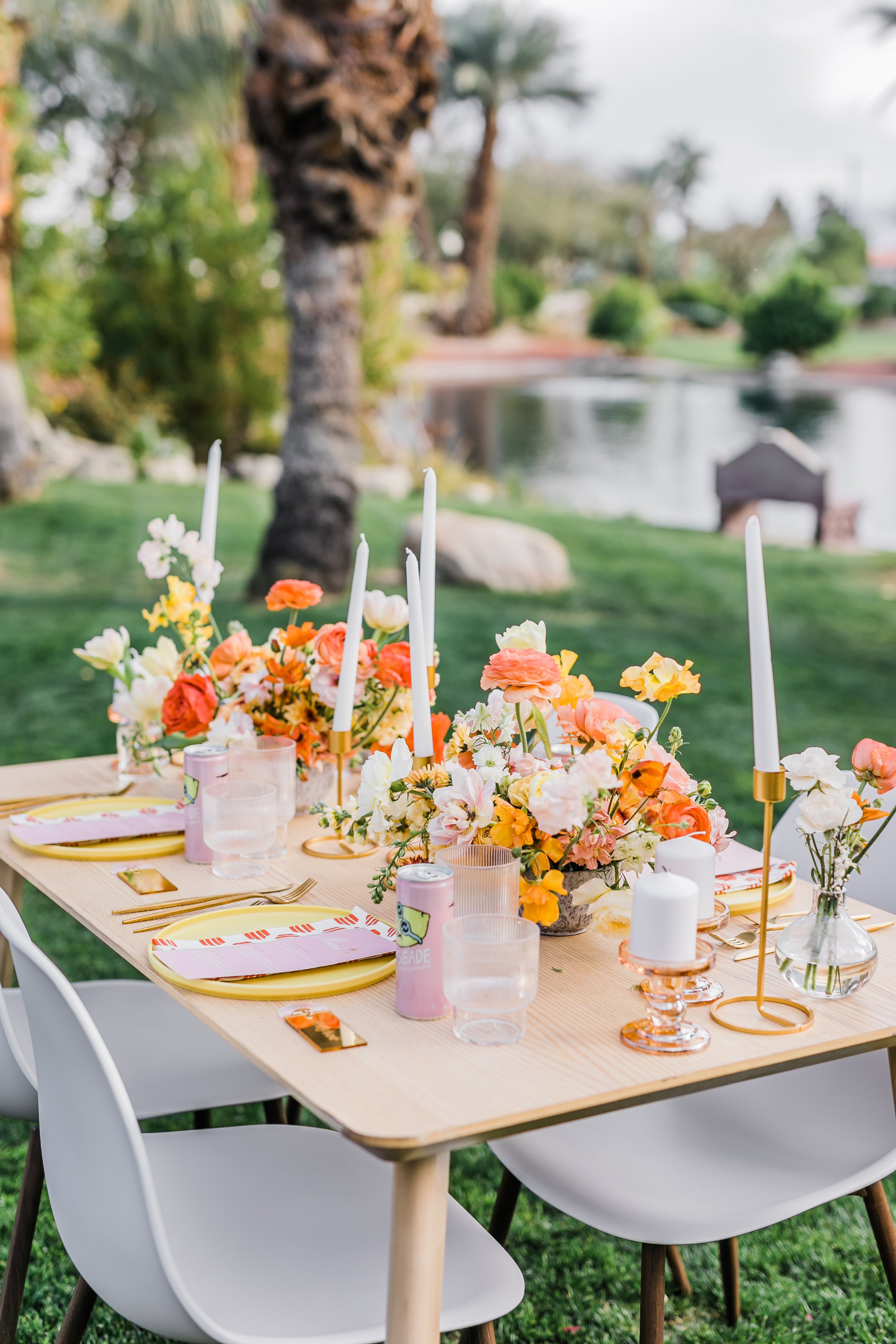 Bright sunny reception table scape flowers and wedding decor at Palm Springs wedding elopement at Bougainvillea Estate.