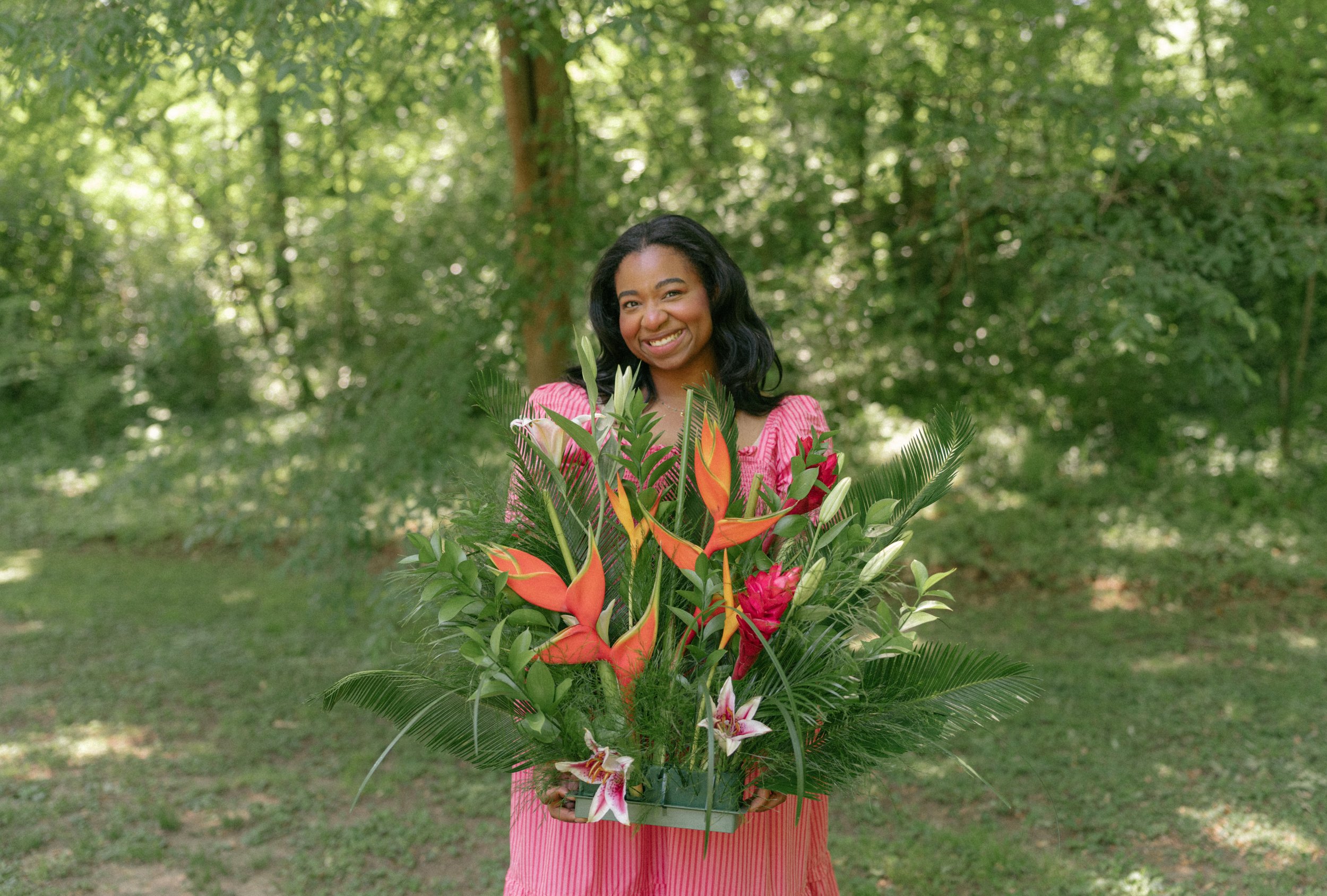 Janelle Soler Atlanta floral designer creating a garden-inspired arrangement