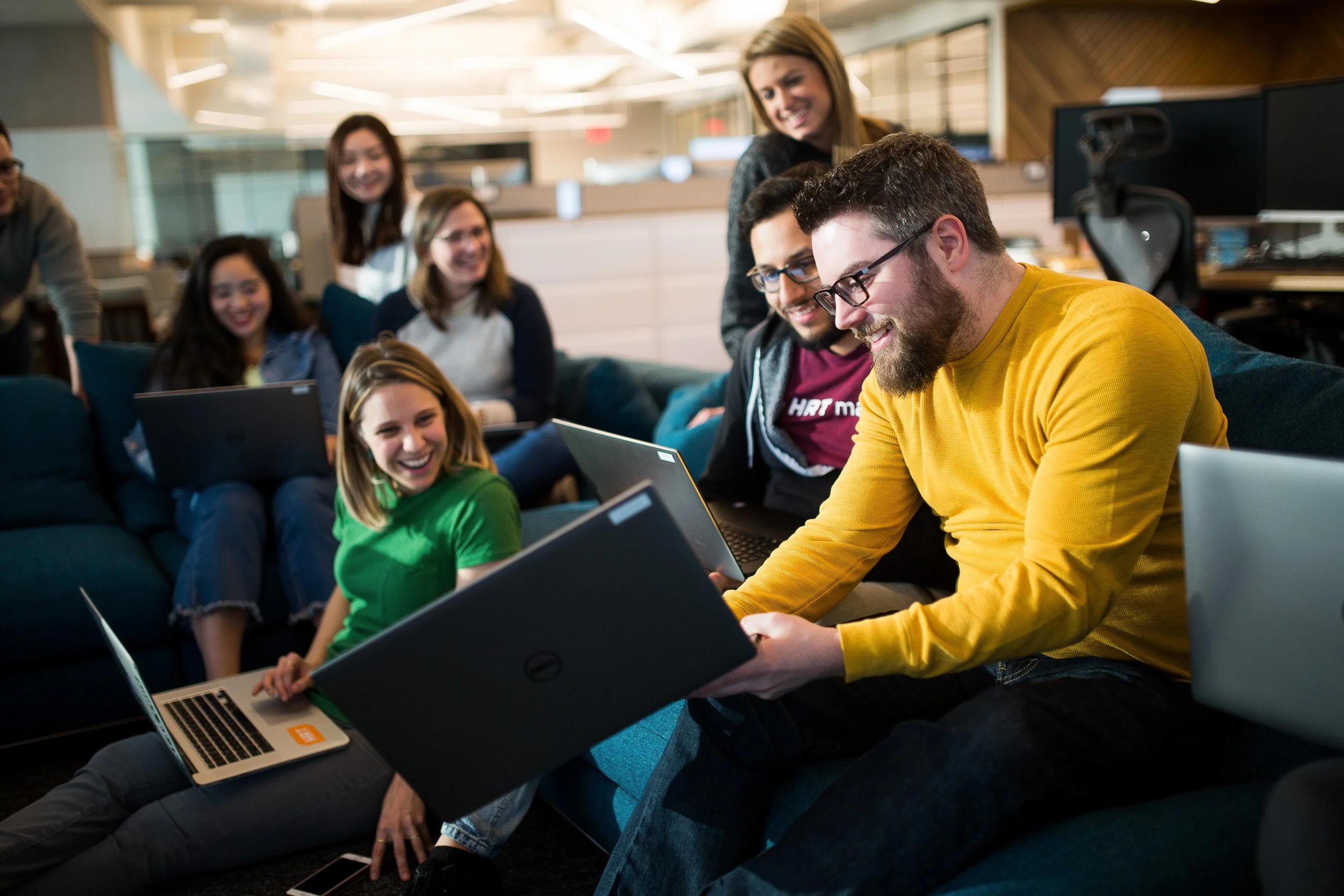 Corporate lifestyle photography of tech company employees working together on a project in their NYC office