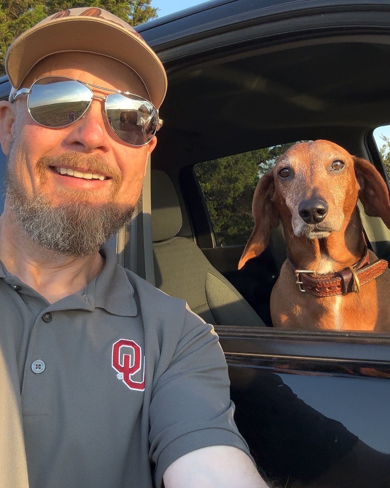 David Schweitzer and Baker, the dog behind Oklahoma Backroad Explorer, exploring Oklahoma backroads, small towns, storms, sunsets, and rural landscapes.
