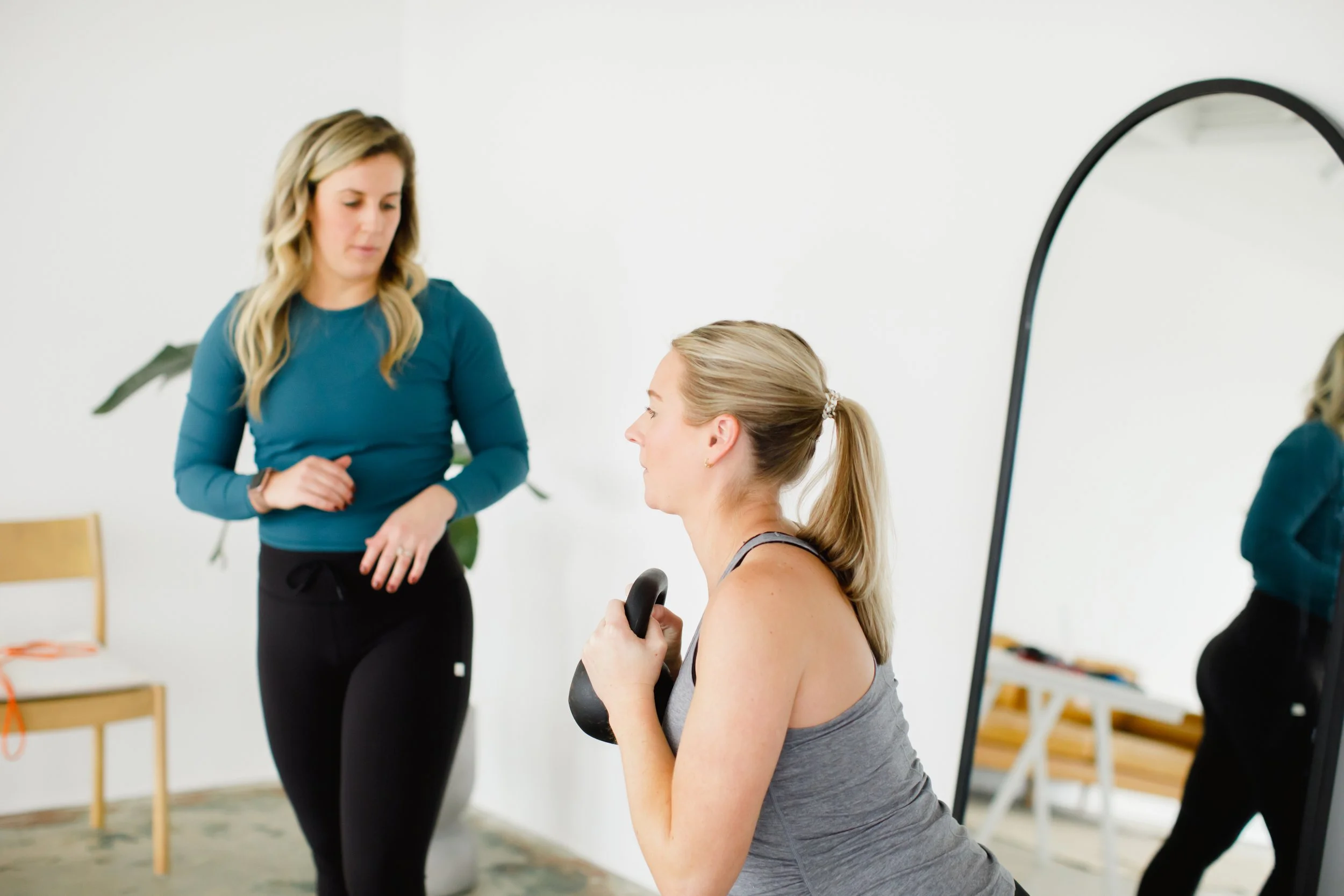 Pregnant woman exercising with guidance of a pelvic floor physical therapist in charlotte NC.