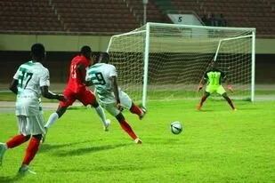 Zico dragging a shot towards Hawks goal