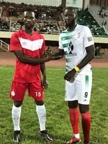 A shake of hands between Zico and Hawks defender Mass Manga.