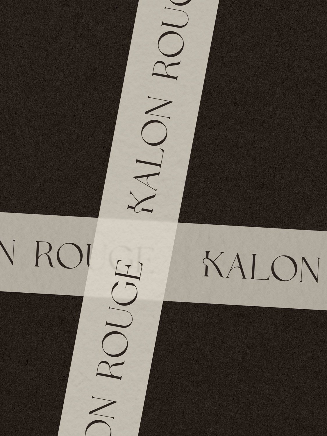 Brown Kalon Rouge brand logo design printed on cream packing tape 