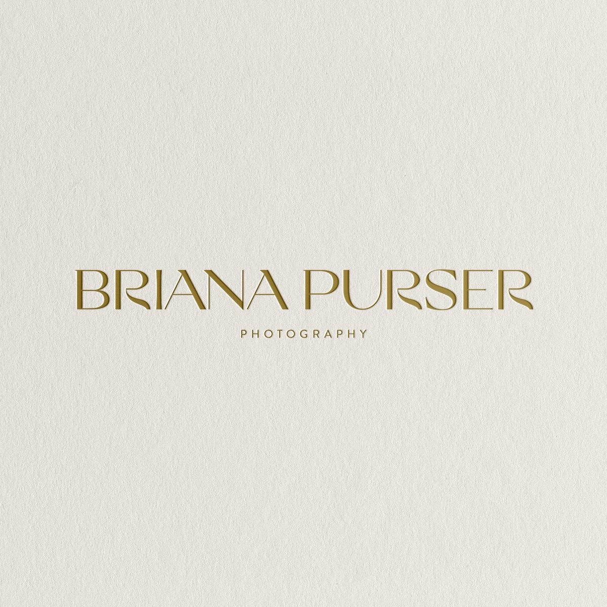 Briana Purser Photography logo debossed in gold green ink on a textured cream paper background