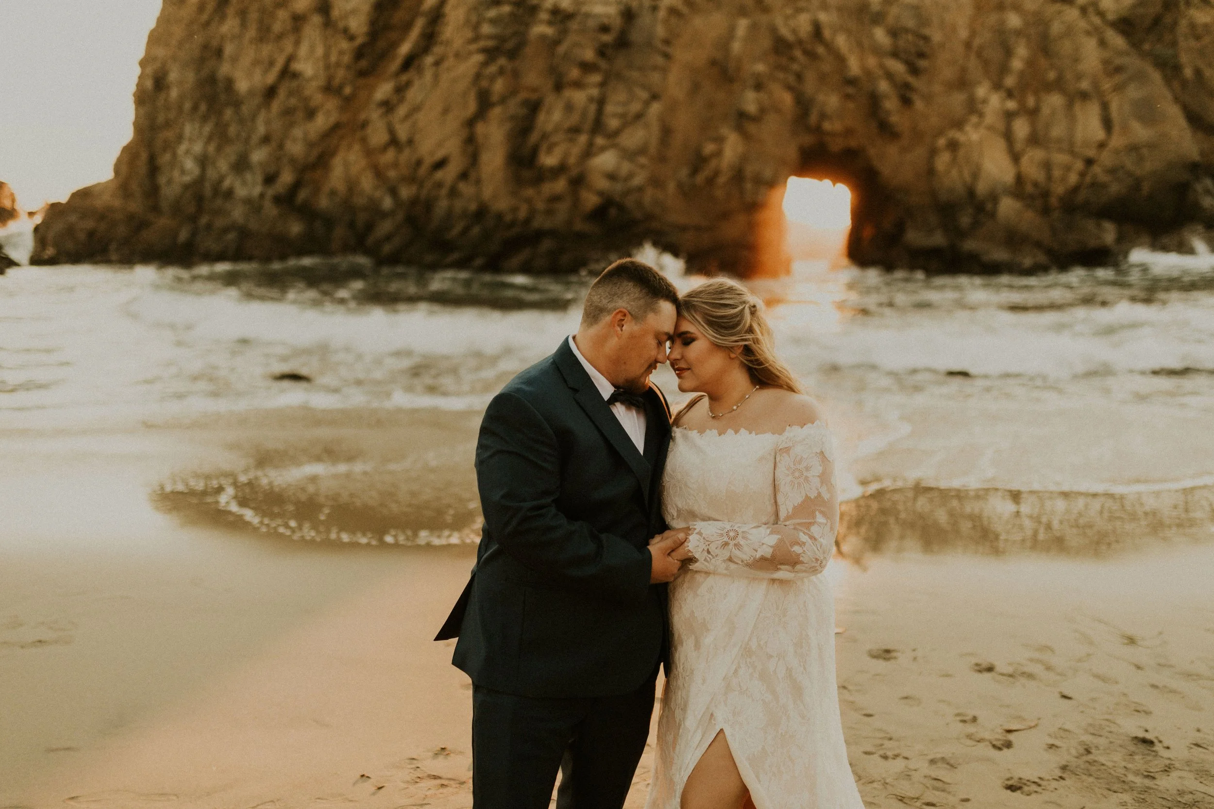 keyhole arch at pfeiffer beach elopement and intimate weddings, bride and groom on the beach makeup artist