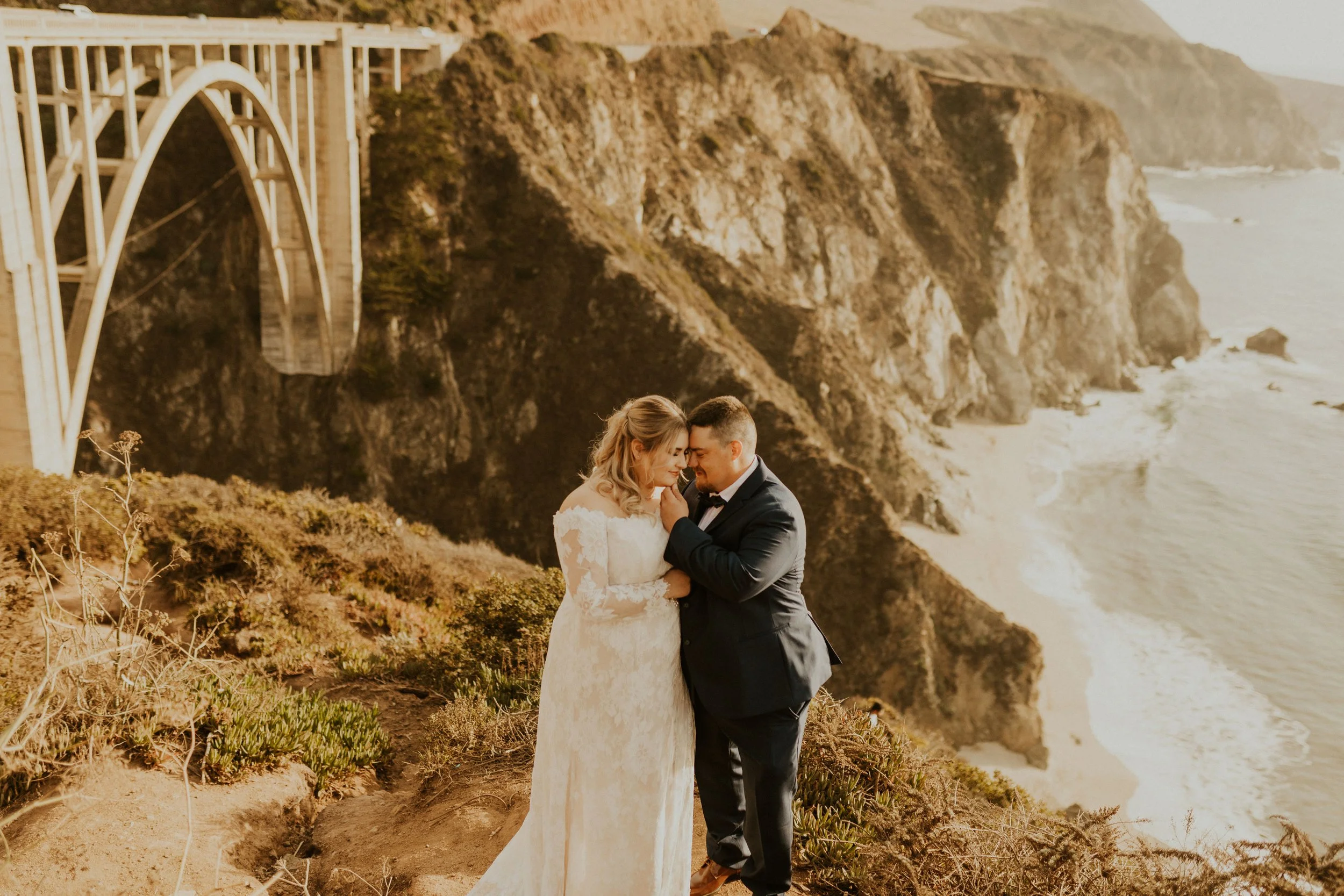 Big Sur California elopement bridal makeup artist and bridal hair in front of Pfeiffer bridge