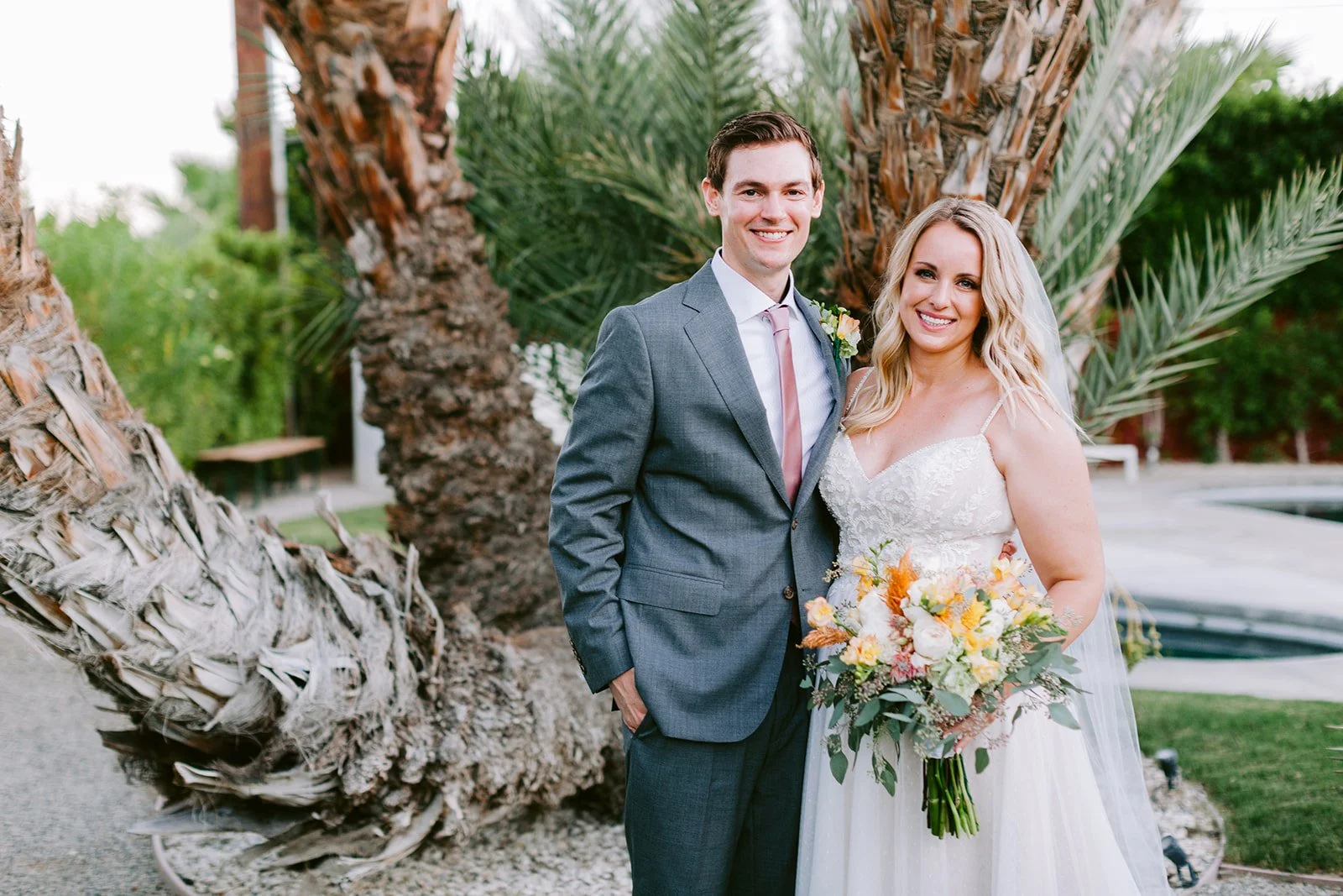 Makeup artist and hair stylist for brides La Quinta the madison club wedding bride and groom photo shoot outdoors