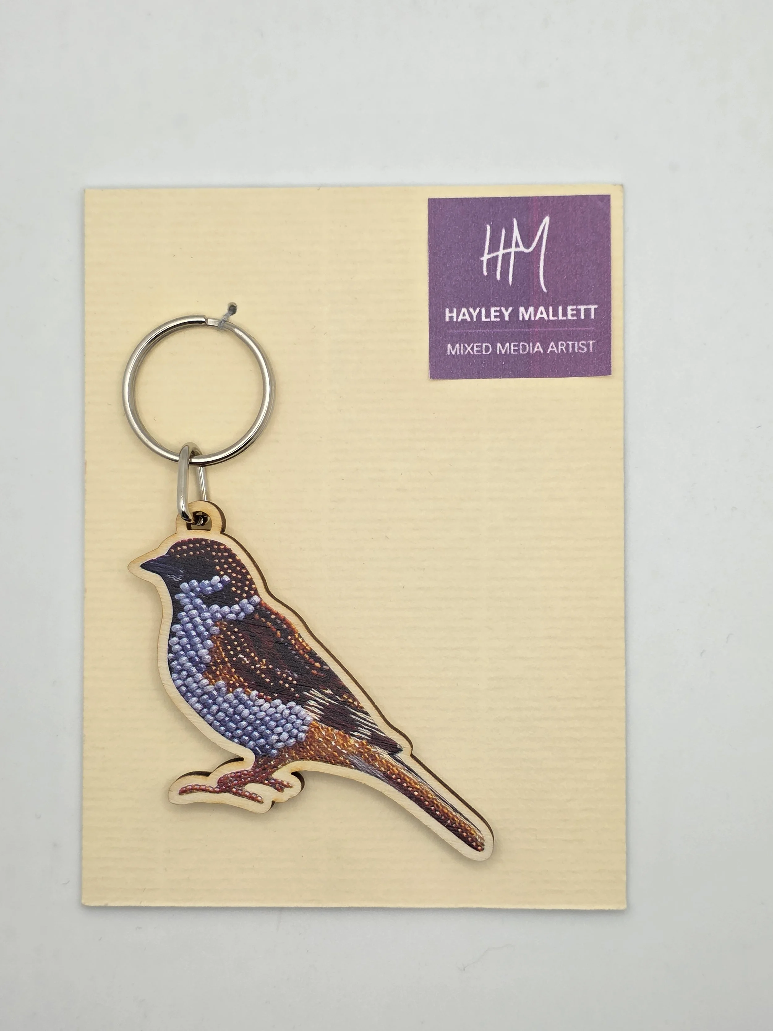 Eurasian Tree Sparrow wooden keyring on branded card packaging featuring original artwork by Hayley Mallett