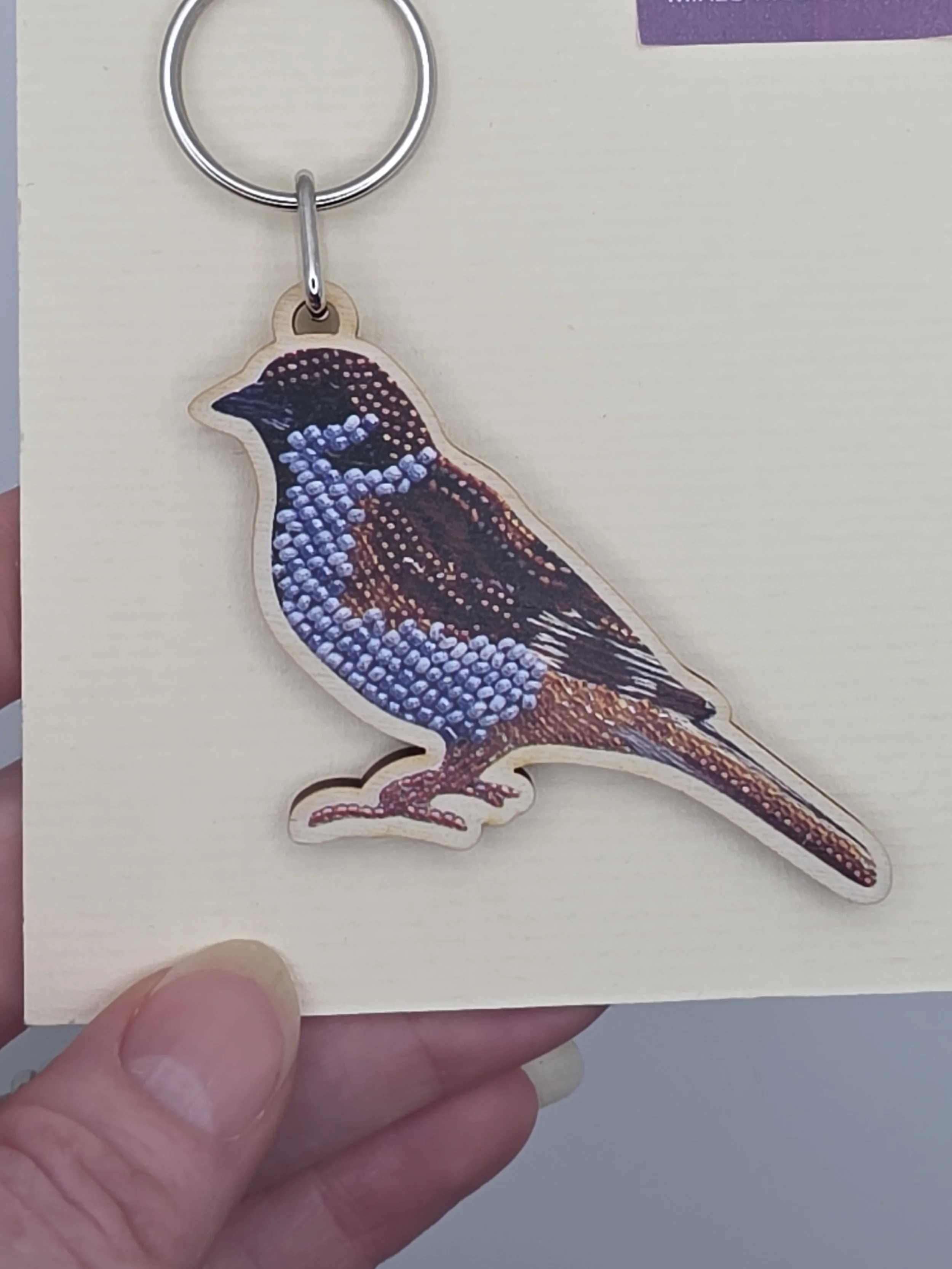 Close-up of Eurasian Tree Sparrow keyring showing a closer view of presentation card.
