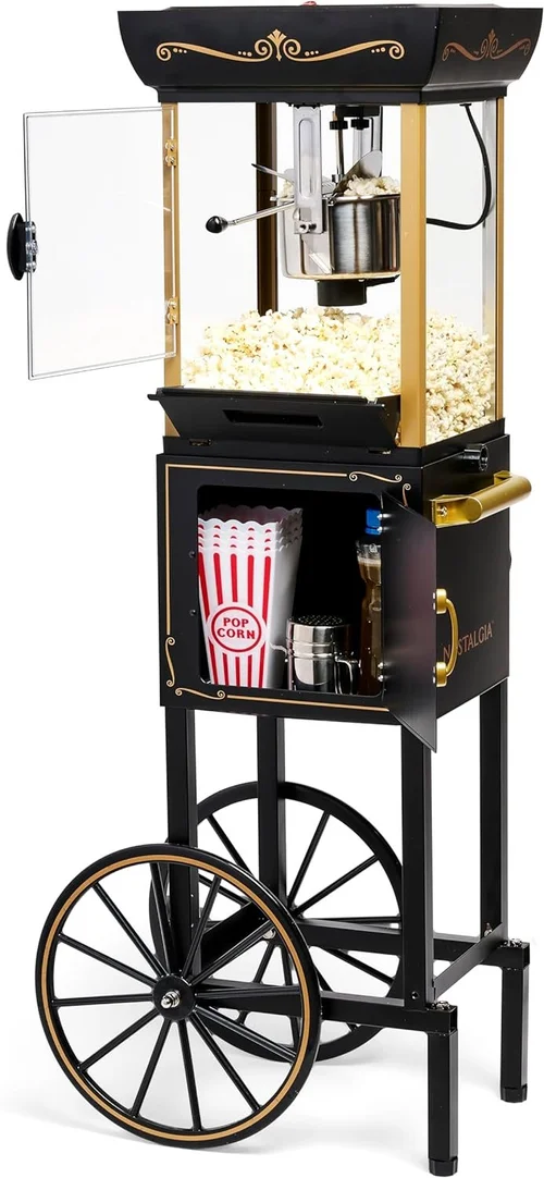 Black and gold popcorn machine on a wheeled cart with popcorn cups and supplies.
