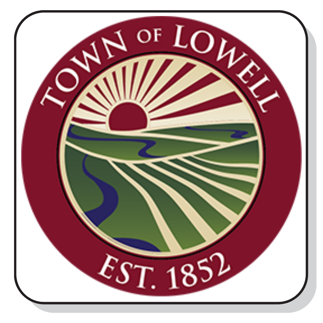 Town of Lowell official seal with a sunrise over fields and a river, established in 1852.