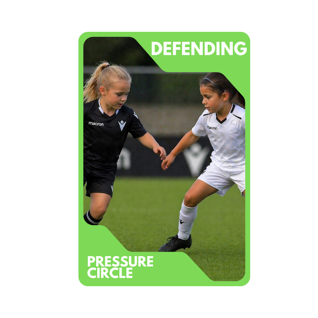 Two young girls playing soccer, one in a black uniform and the other in a white uniform, engaging in a pressure circle drill on the field.