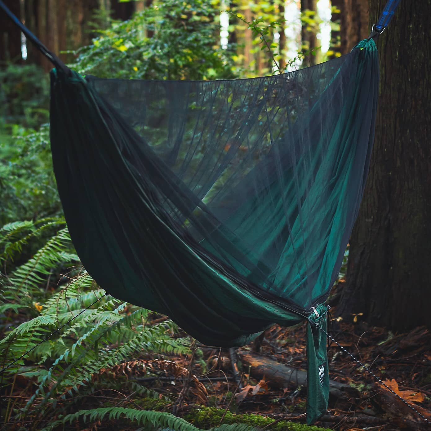 As the warm spring weather is upon us, the Camp Hammock is the perfect way to enjoy a comfortable, bug-free experience on your next outdoor adventure.🏕️ 
-
-
-
-
-
#TrailPrepared #YouBelongOutdoors #CampHammock #Hammock #ParachuteHammock #MosquitoNe