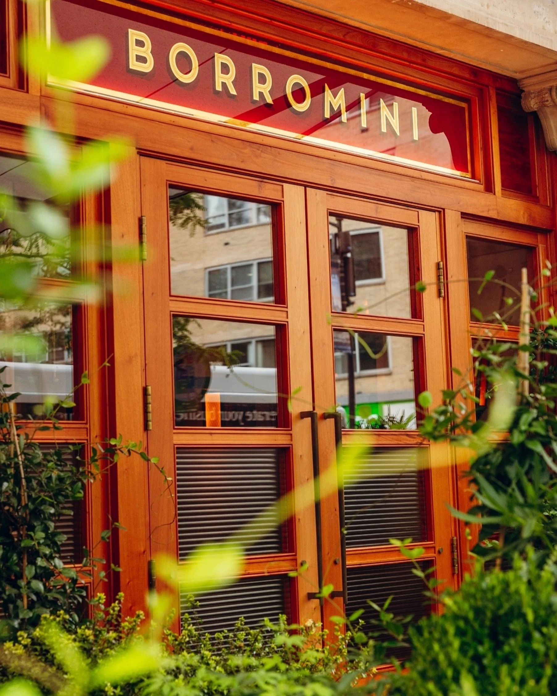 Mucca Borromini Front Entrance Doors with Greenery 1.jpg