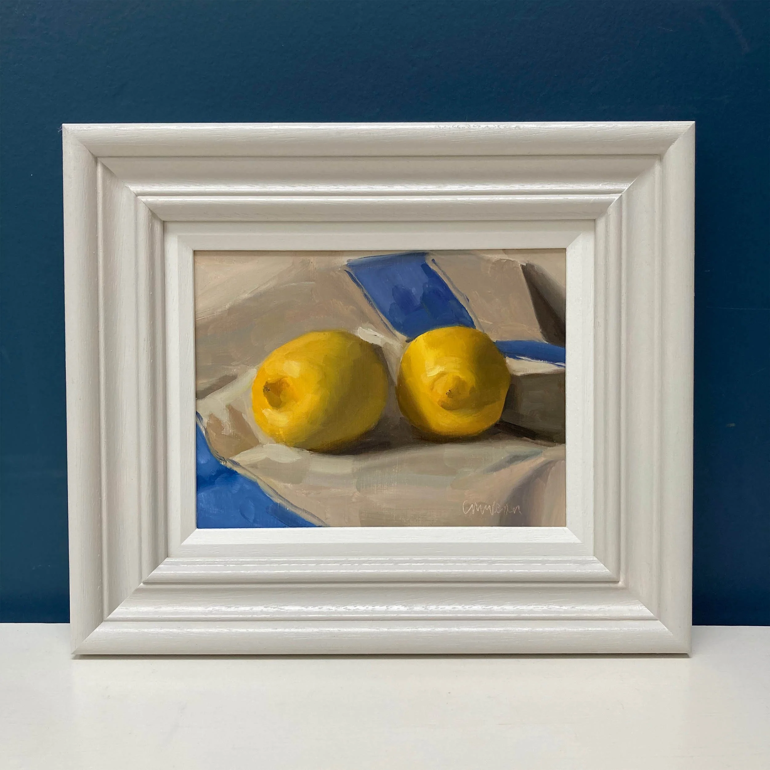 Framed painting of lemons and french linen cloth