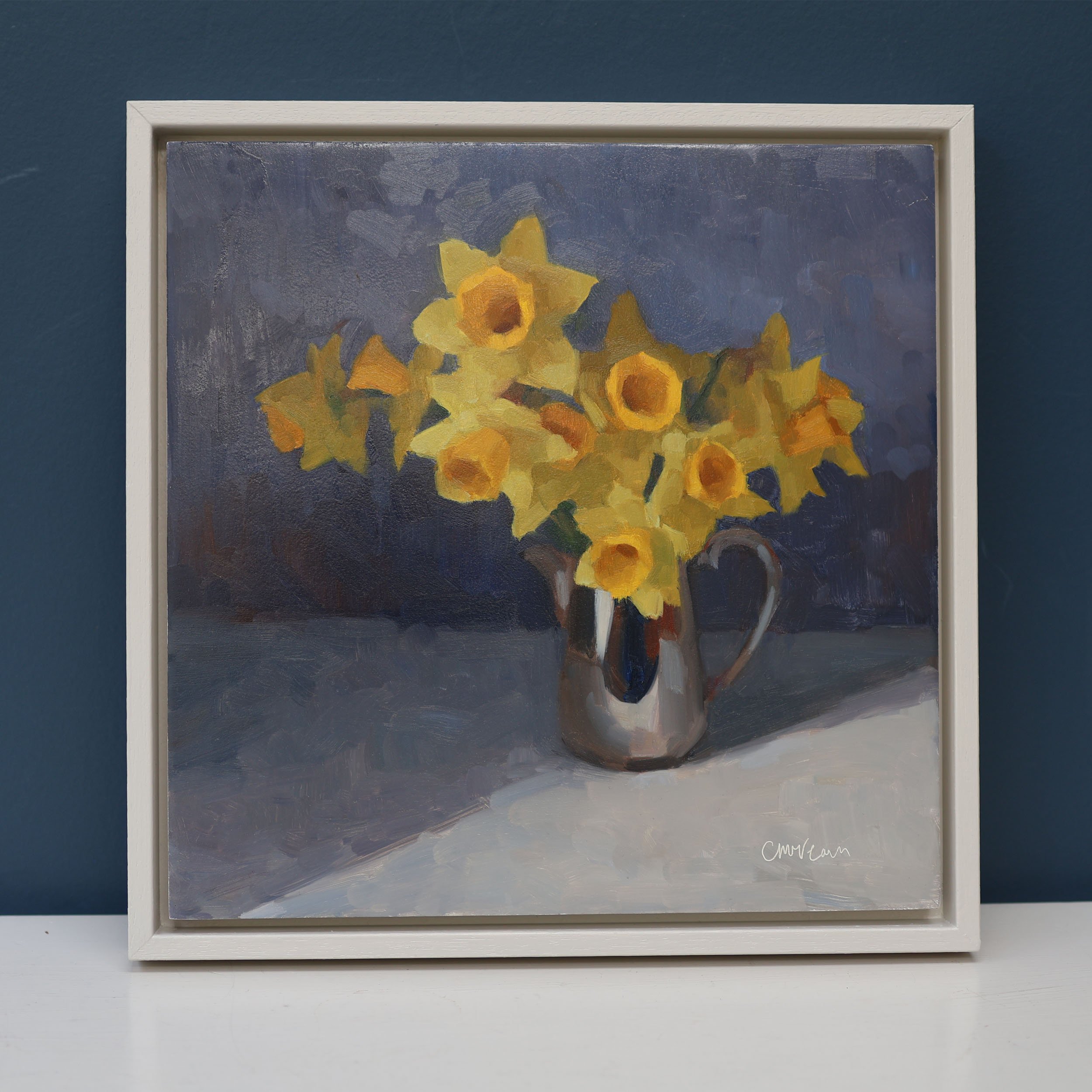 Painting of yellow daffodils in an antique silver jug