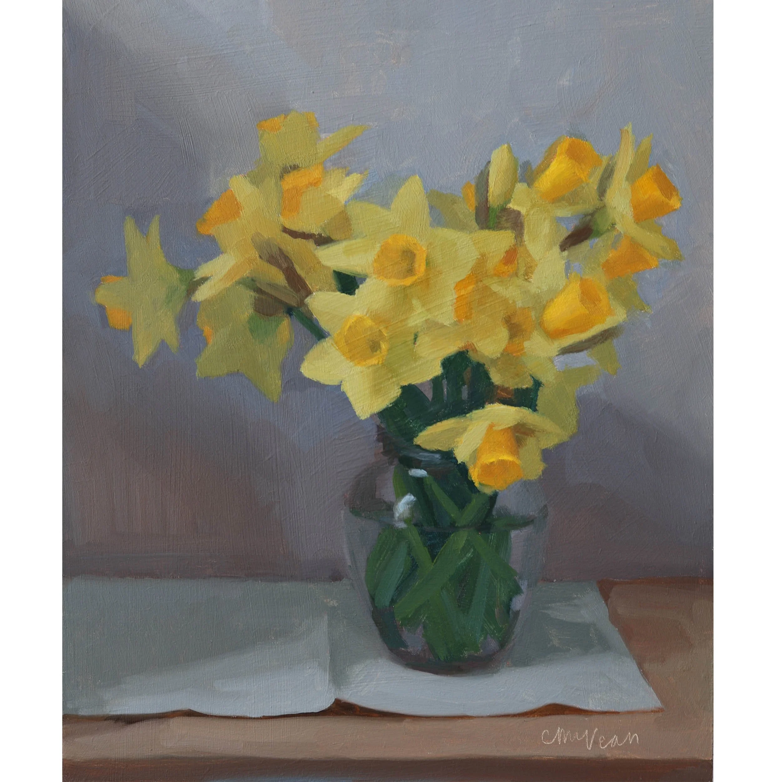 Daffodils in a glass honey jar