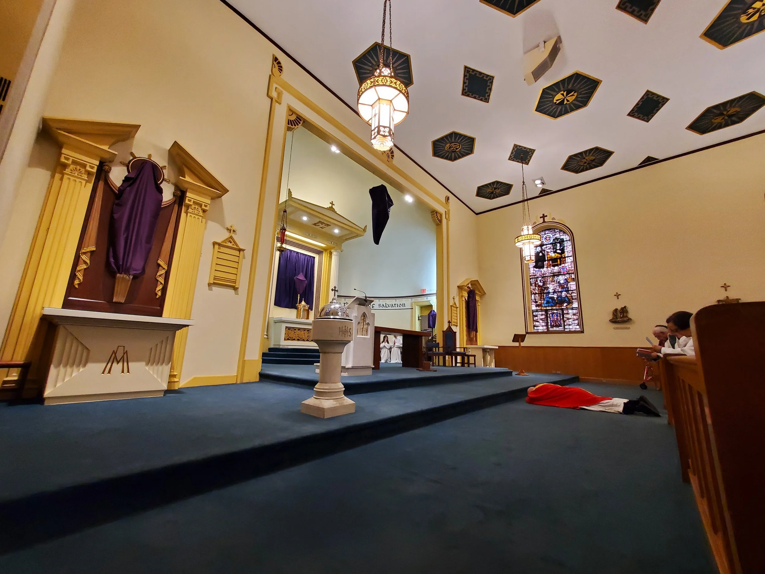 Father lies prostrate at the beginning of the liturgy to express sorrow for our sins that led to Christ's crucifixion, humility to acknowledge our weakness and dependence on God's mercy, and show reverence for Jesus' sacrifice.