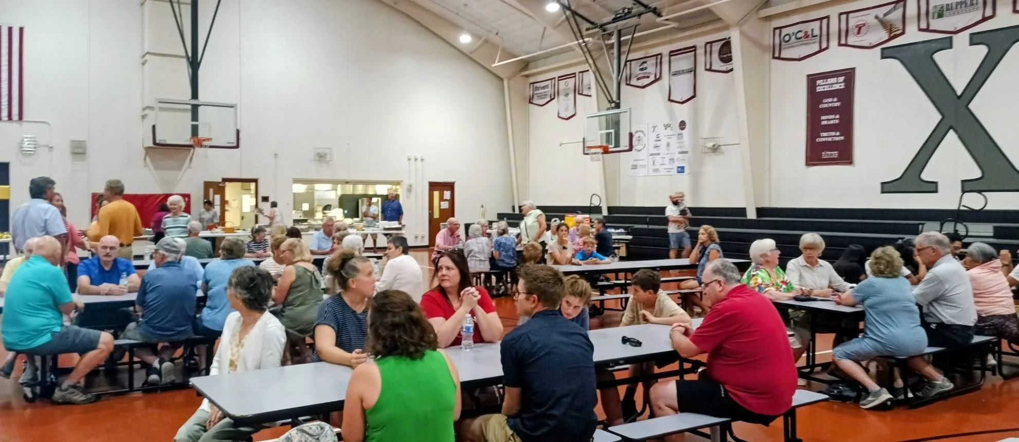 Crowd at tables in MPR.jpg