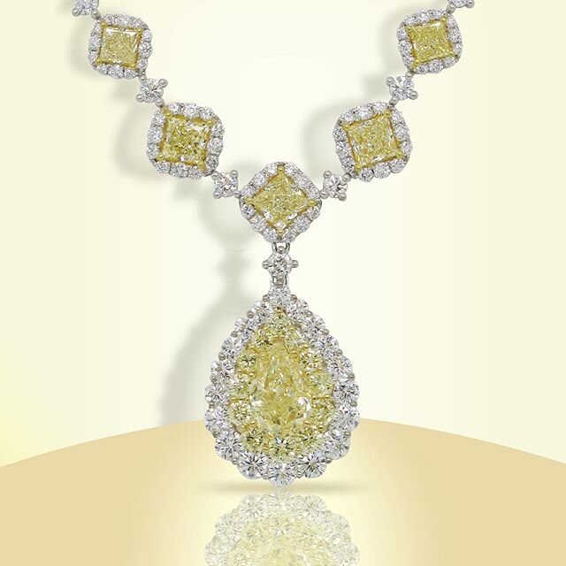 Fancy this! Our magnificent 2.25ct GIA, fancy yellow, pear shaped, diamond necklace is red carpet ready. Featured with our stunning center stone are 12.5ctw fancy yellow side stones, surrounded by 9.51ctw white diamonds, set in 18k white and yellow g