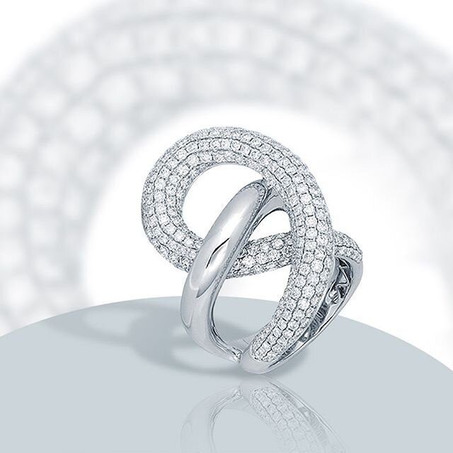 Forever in fashion! Our unique cocktail ring spirals 2.75ctw of white diamonds around its beautiful curves. Handcrafted in 18k white gold. #houseofbaguettes #highjewelry #diamondjewelry