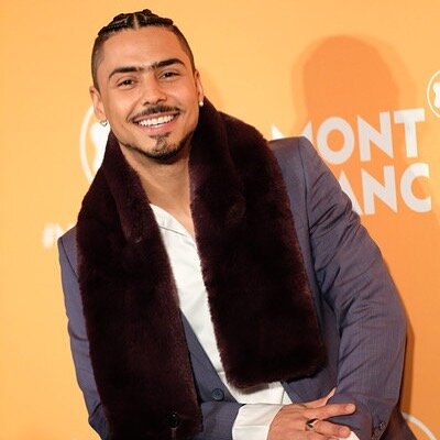 Purple reign! @quincy is all smiles wearing the Renald suit and Charli faux fur scarf by @ted_baker_menswear. Thank you @thenanimal.