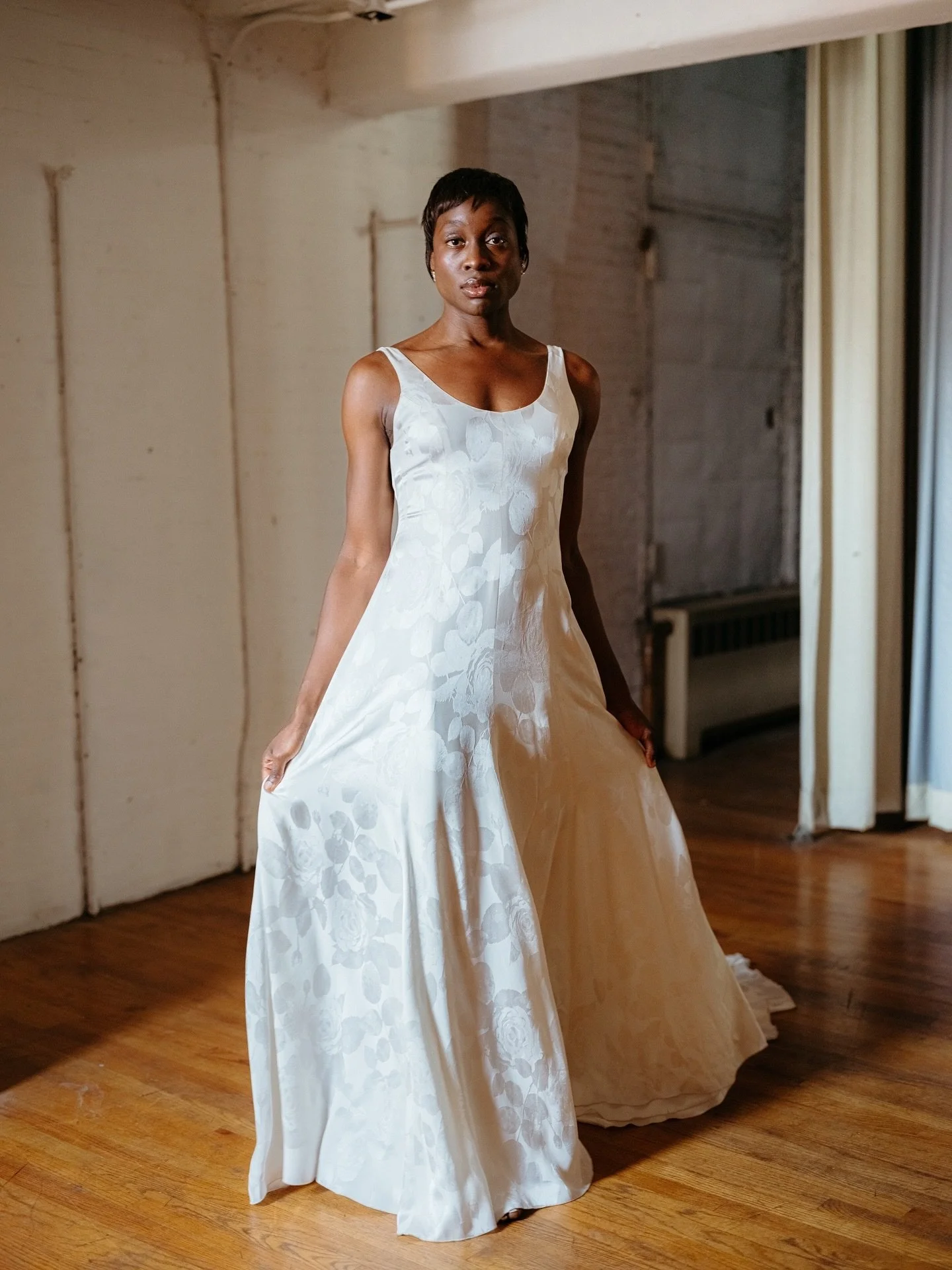 CLEMENTINE | Clementine is chic as can be, with clean princess seams to fit and flatter every curve. Created with our gorgeous satin jacquard with a classic floral motif, our Clementine gown is effortlessly minimal, with classical bridal elements tha