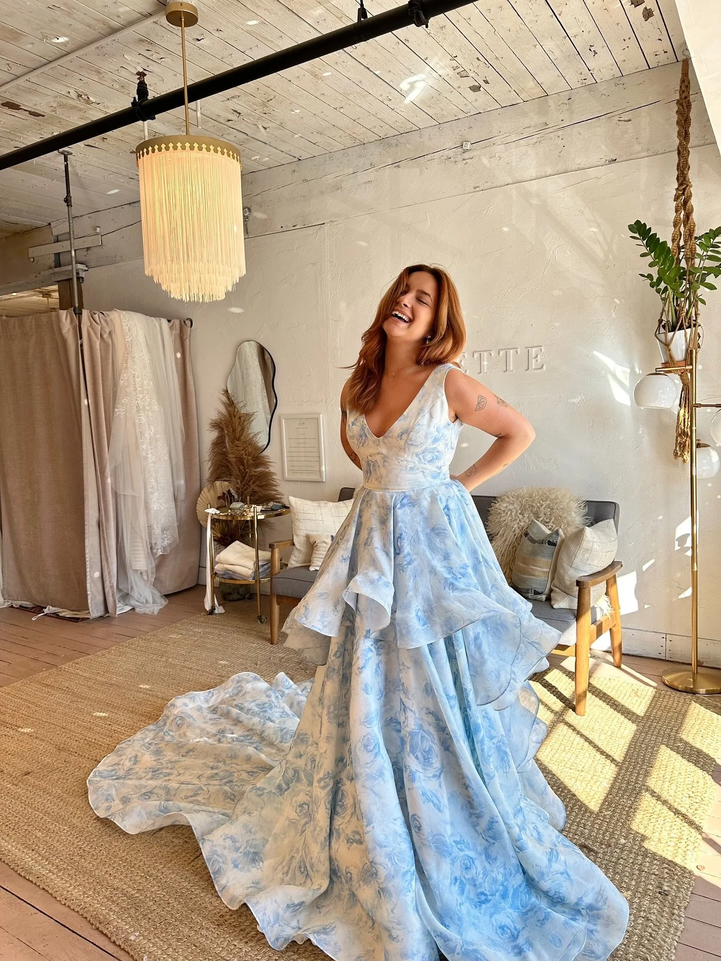 Our Skylar gown is surely your something blue 🦋🩵🧵

in our Italian silk satin face organza with a gorgeous light blue floral print. She has a supportive v-neckline, wide waistband for a cinched waist, pockets at the side seams, and layers of ruffle