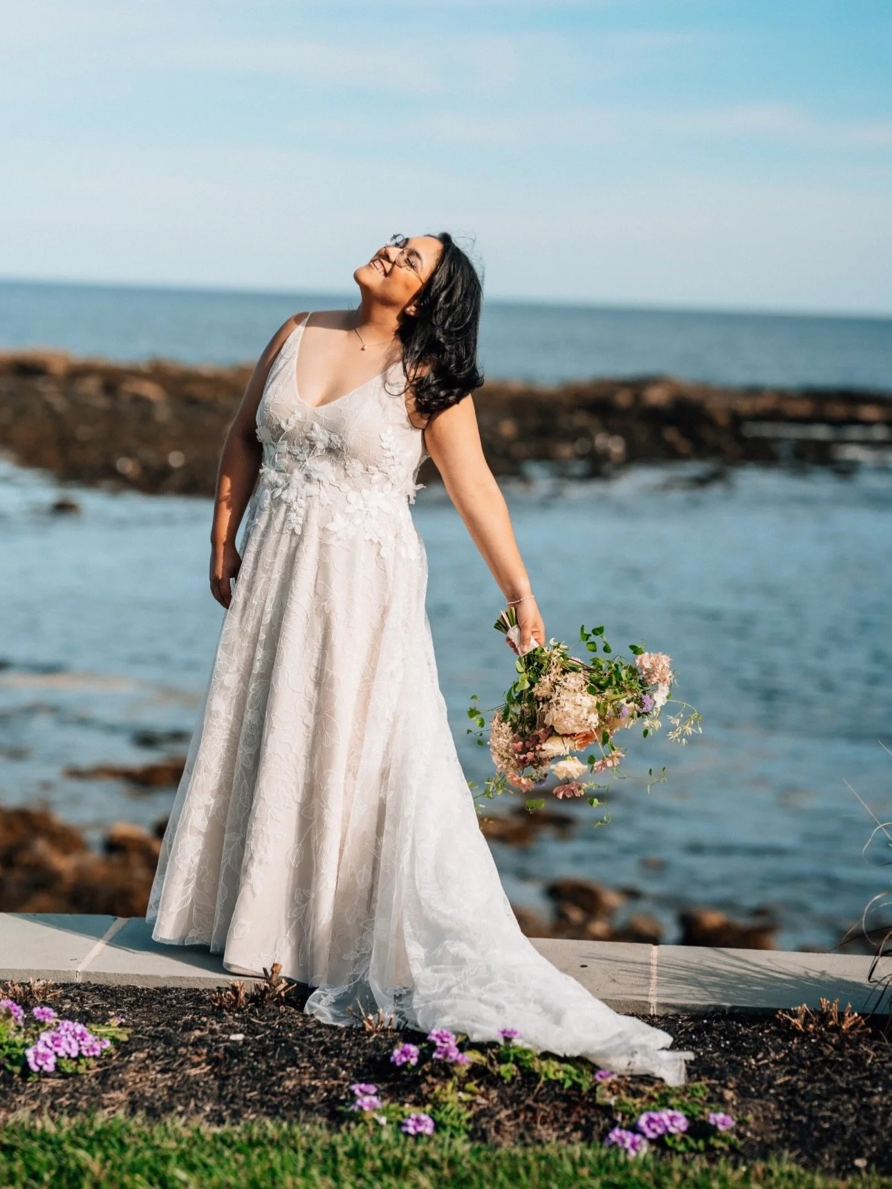 Campbell gown on #realloulettebride Jessica🌸 Campbell is all about balancing less AND more- she has your easy and effortless silhouette, but she&rsquo;s covered with some major flower power! With a rounded v-neck open neckline and soft a-line skirt,
