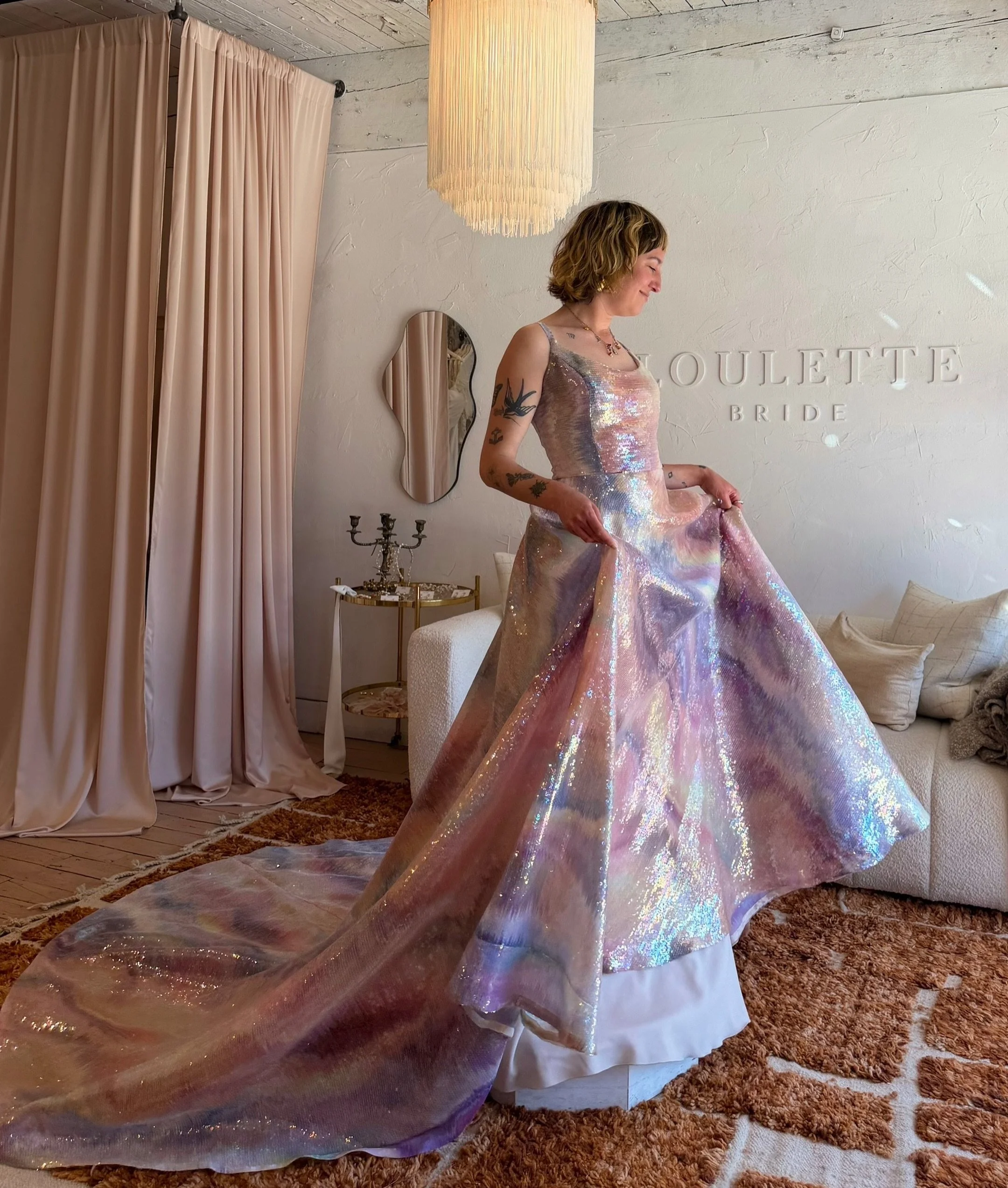 ✨MEADOW GOWN✨

If you happen to be the coolest bride in the universe, and you are looking for a rainbow sequin sparkling gown for a wedding that is, let&rsquo;s say, disco mermaid themed, then look no further! Her name is Meadow, and she is literally