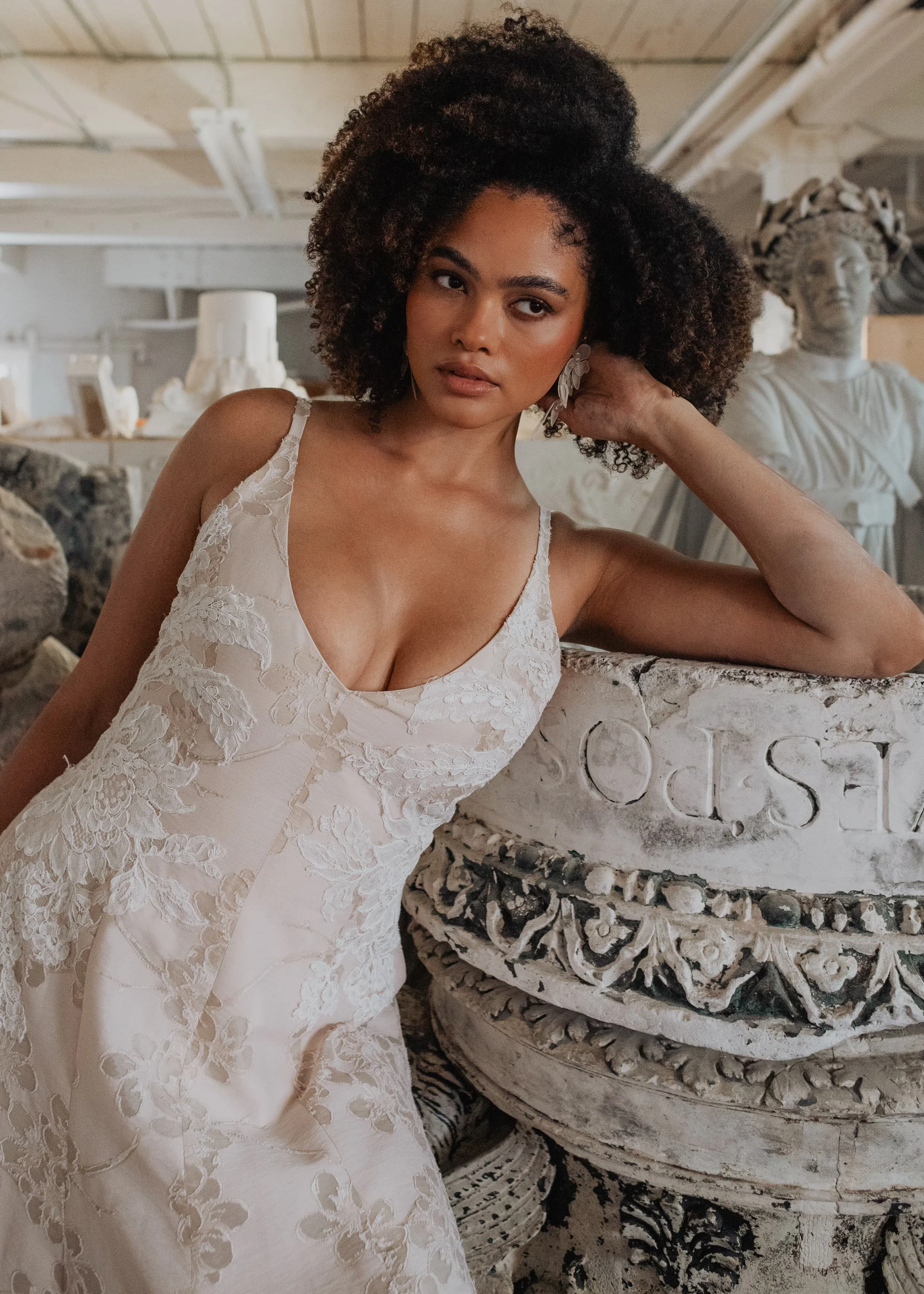 Fit and flare princess seam wedding dress with deep v-neck in blush